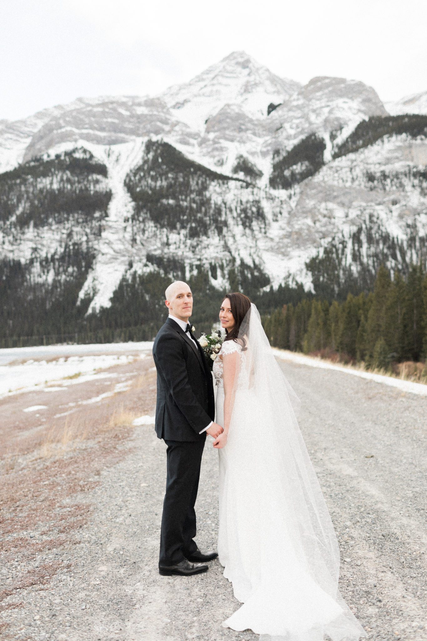This Monochromatic Calgary Minimony Ends With Sunset Portraits in the Mountains Featured by Brontë Bride