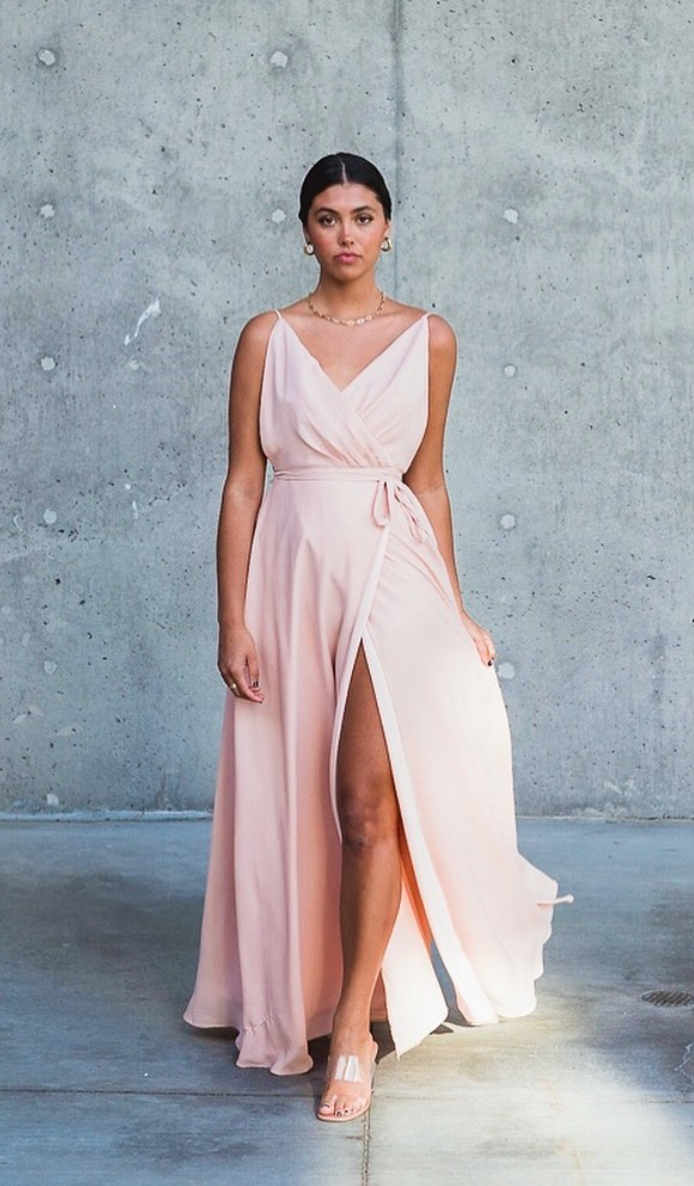 Bridesmaid dress with a plunging neckline and a high slit in the left side. 