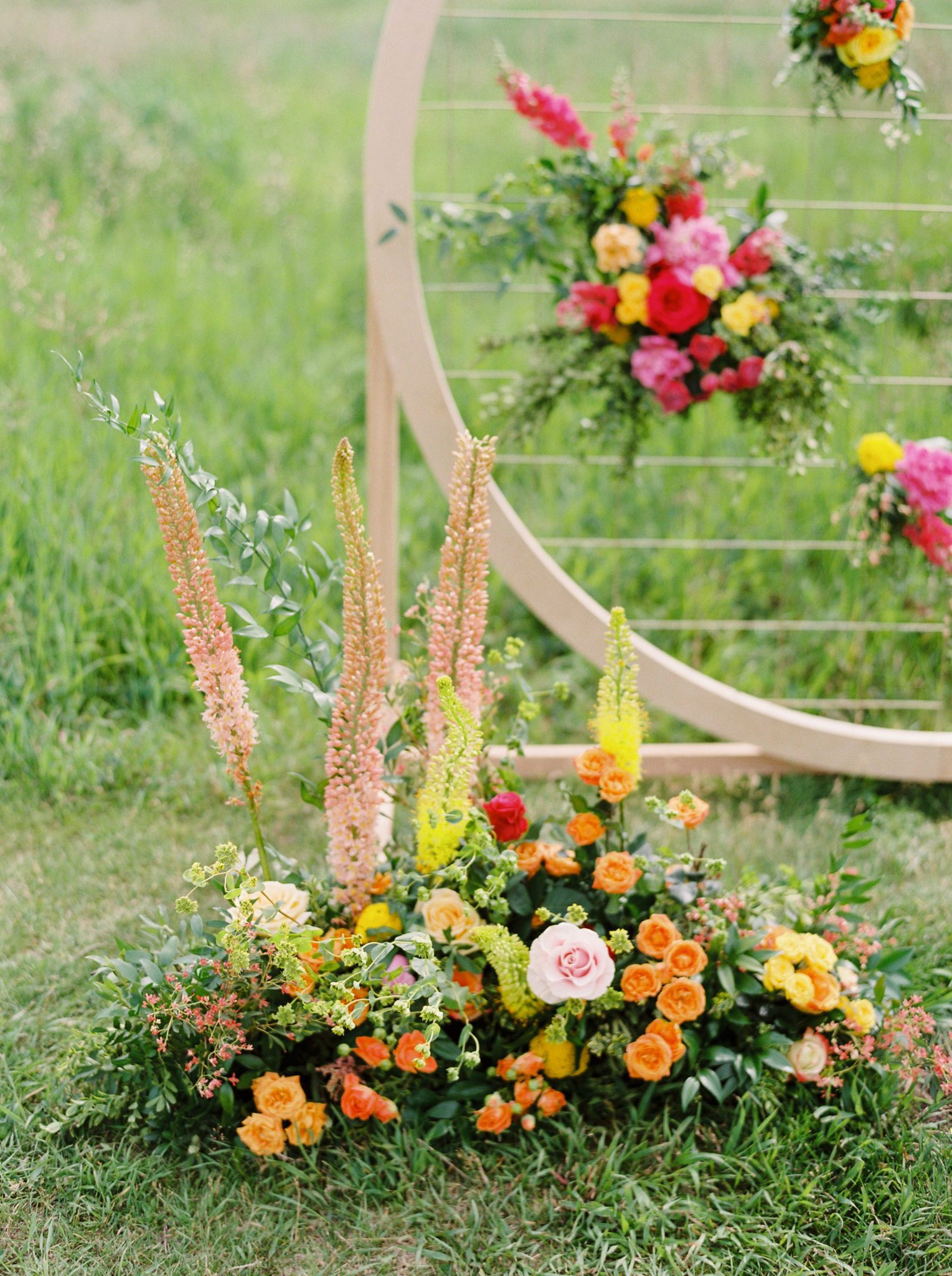 Farmhouse Chic: A Vibrant Wedding Inspiration Shoot at the Gathered | Brontë Bride Blog - Modern Wedding Arch with Bright Colourful Flowers