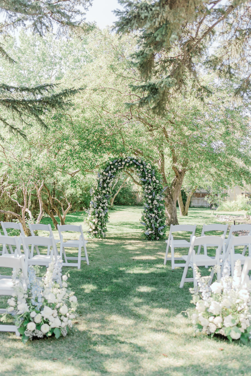 Timeless greenery floral arch with white blooms