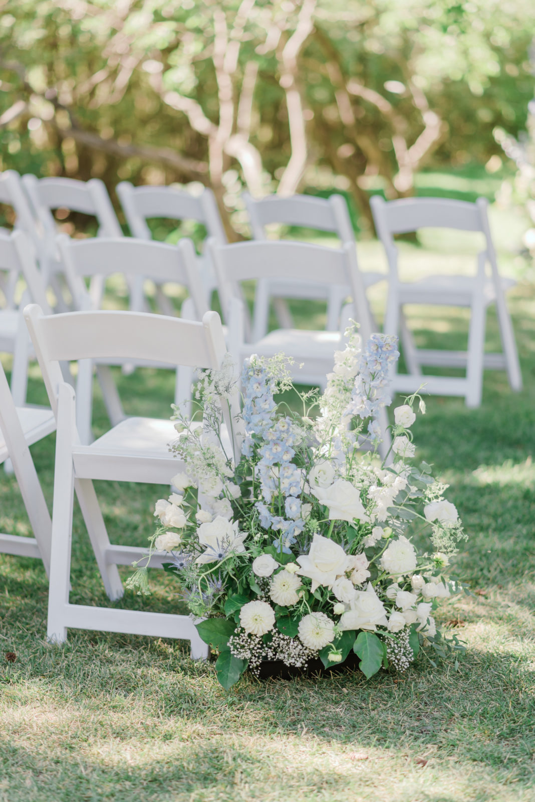 Ceremony aisle decor with blue and white flowers for this timeless wedding inspiration in Calgary Alberta with fine art photography
