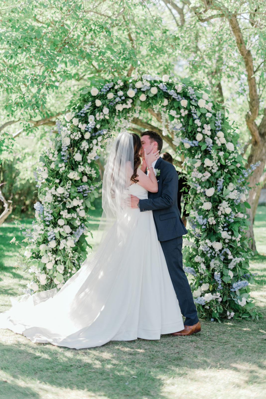 Outdoor summer wedding with stunning floral arch in Calgary Alberta at Rouge Restaurant 