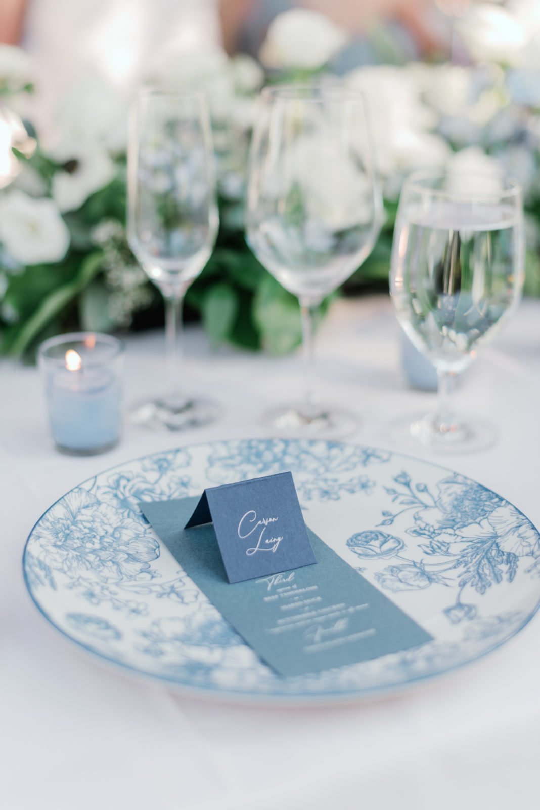 Pale blue and white table settings for a classy wedding reception