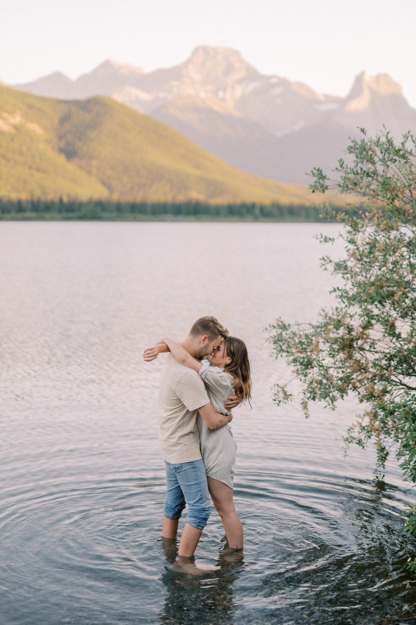 Couples session in the mountains with a dip in the lake