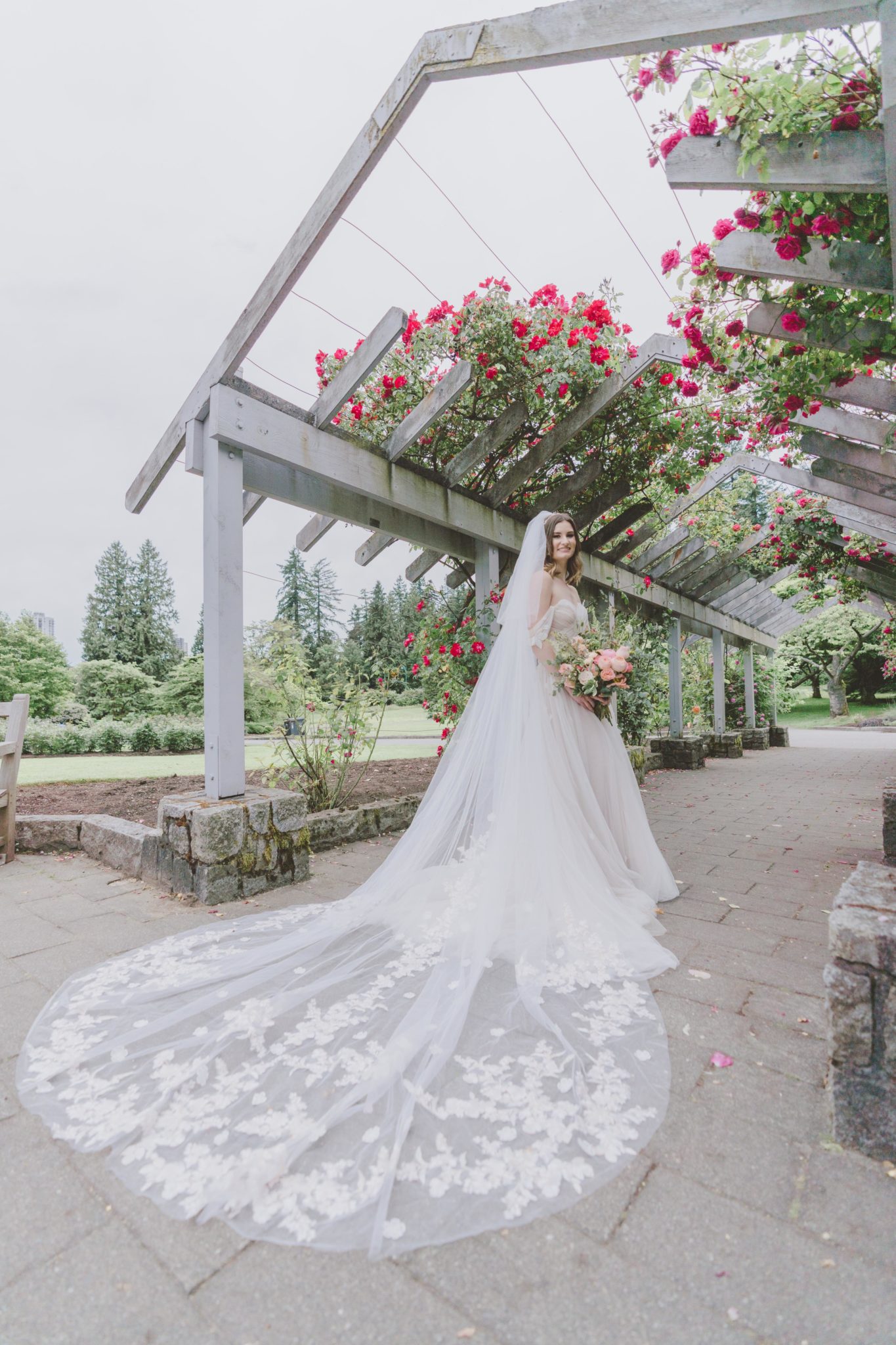 Cathedral veil with a romantic Lillian West wedding dress