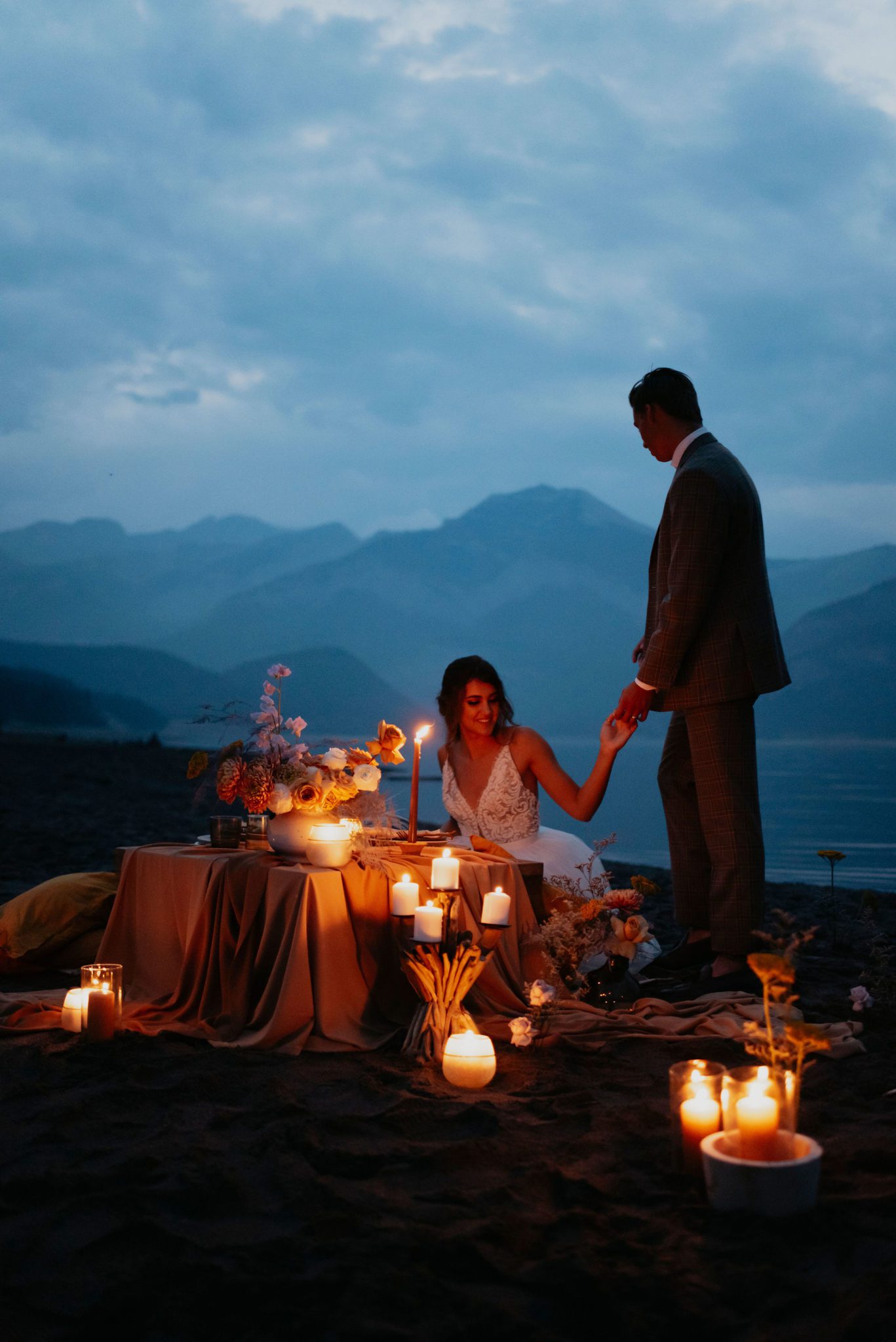 Blue hour wedding portraits with candlelight sweetheart table