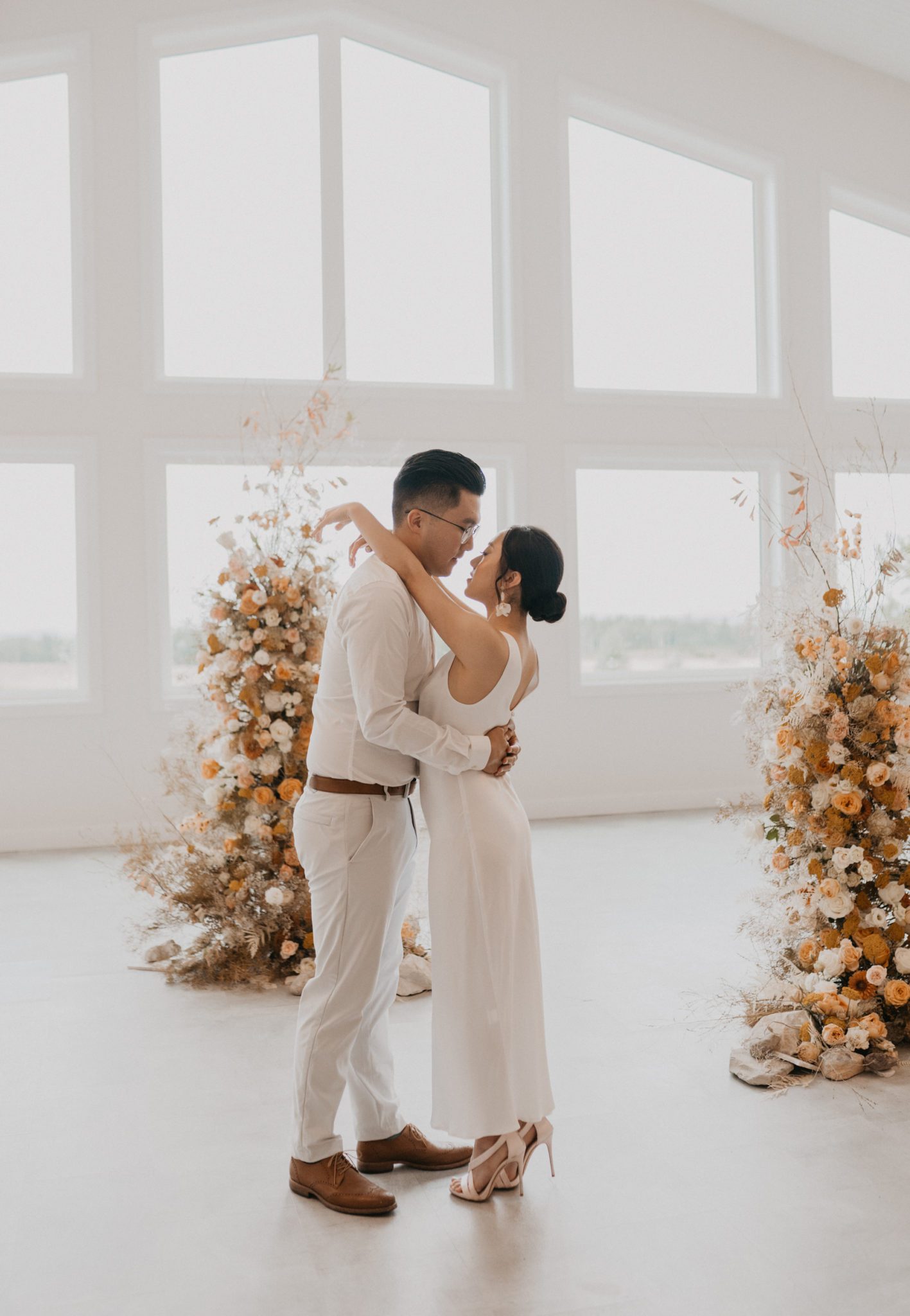 Modern and chic couple at the Tin Roof Events Centre in Alberta