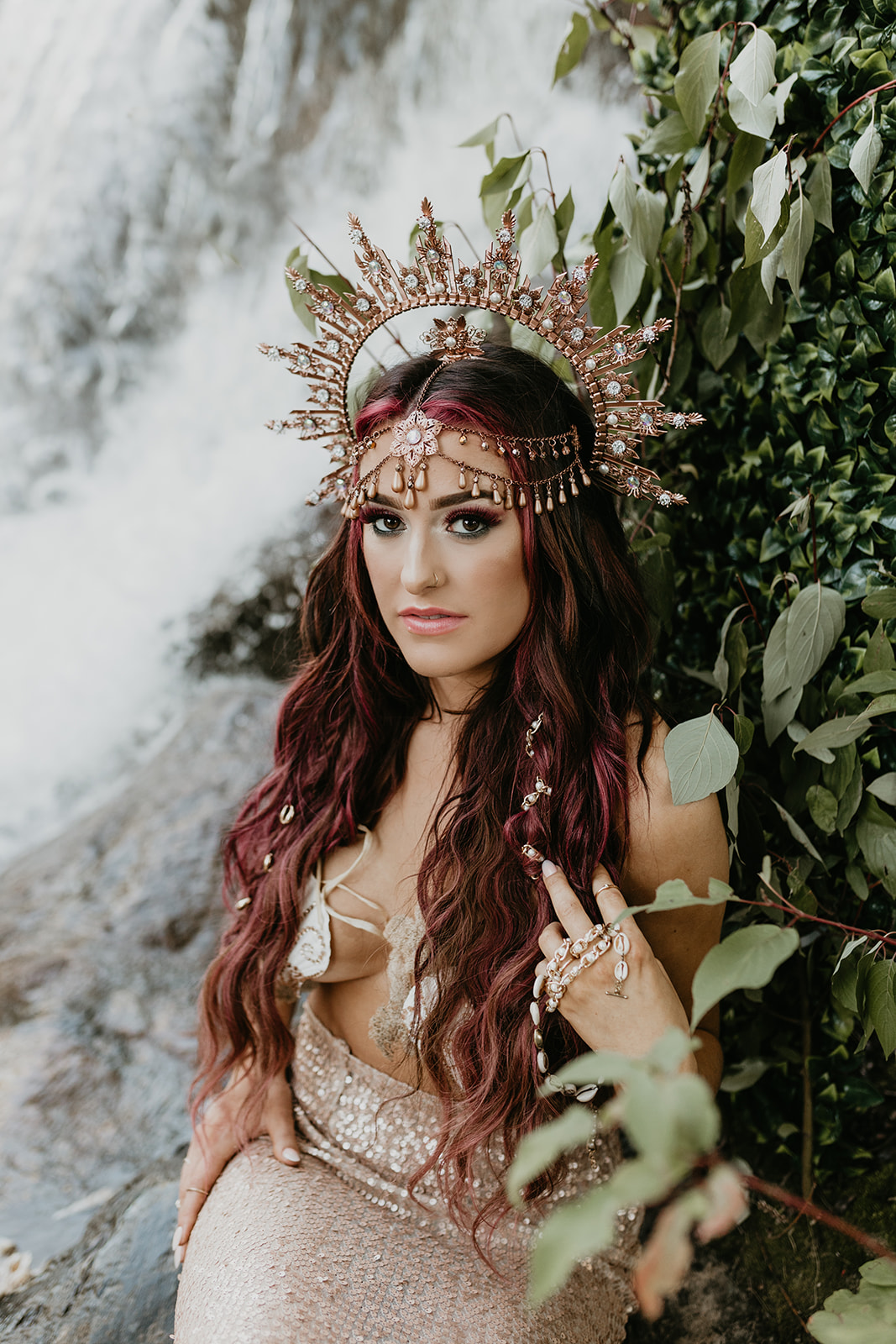 Bohemian mermaid photo shoot in front of a waterfall