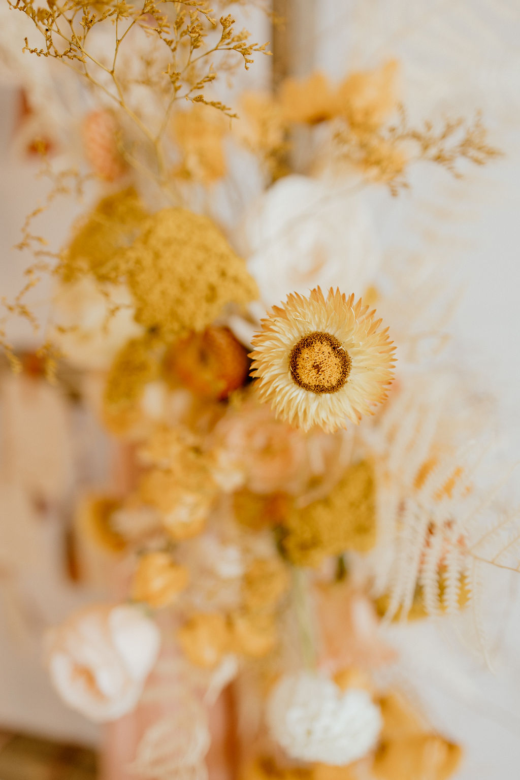 Dried autumn florals in yellow, peach, cream and white hues
