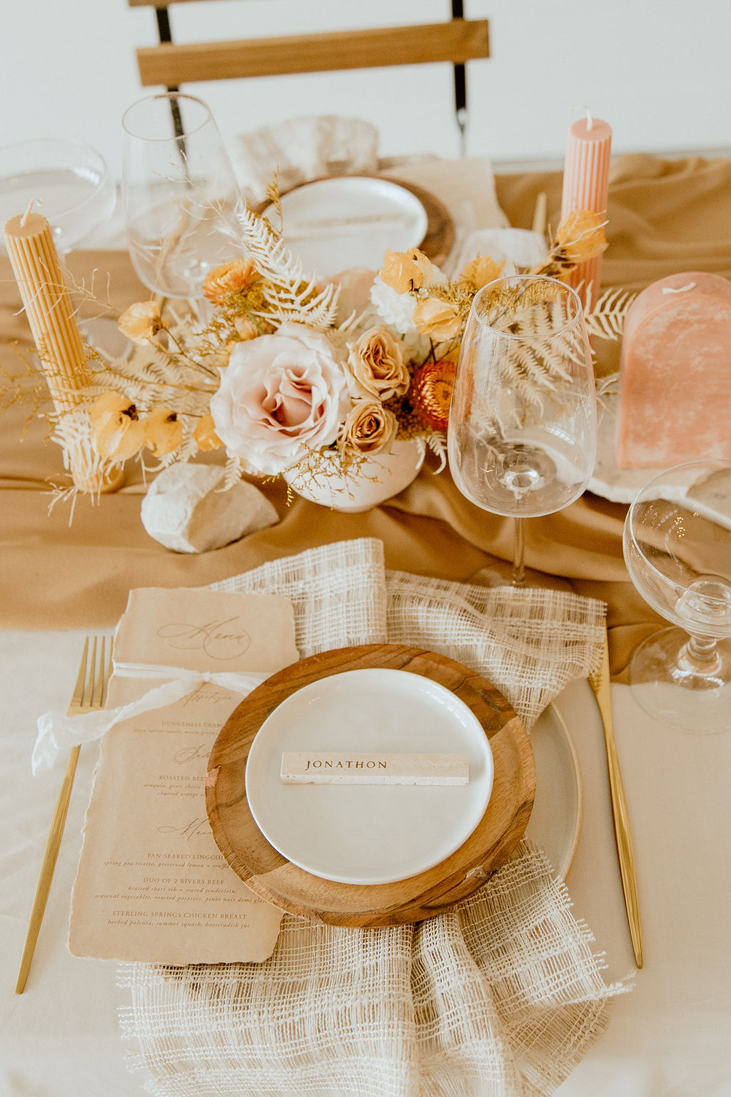 Boho reception table decor with wood, burlap and paper finishes