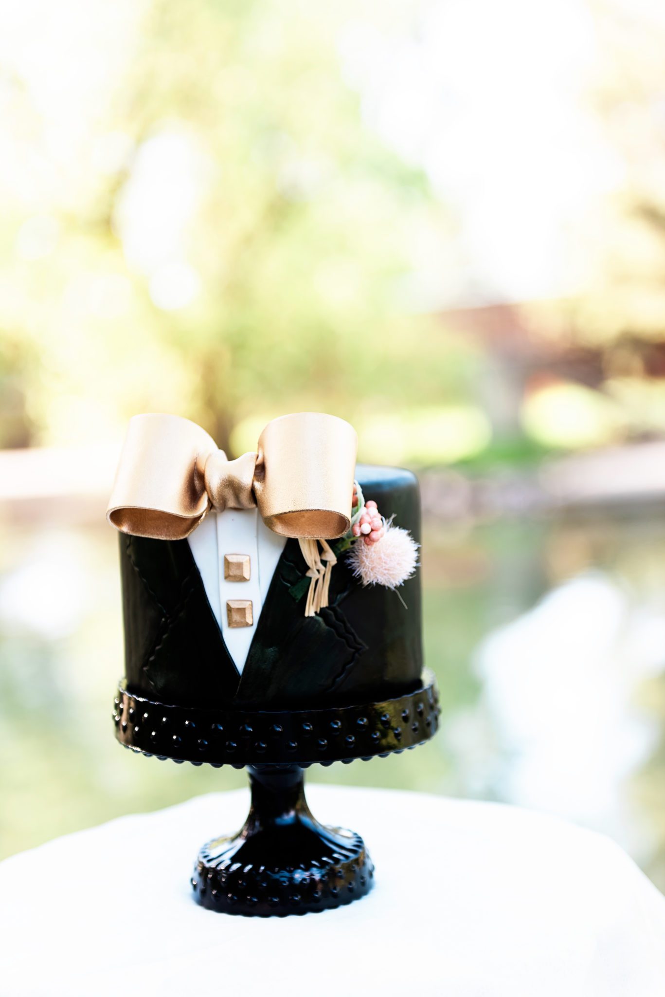 Cute tuxedo themed wedding cake for the groom