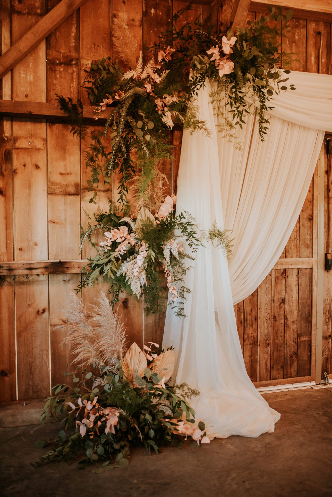 Western wedding decor inspiration for a boho bride with florals and drapery
