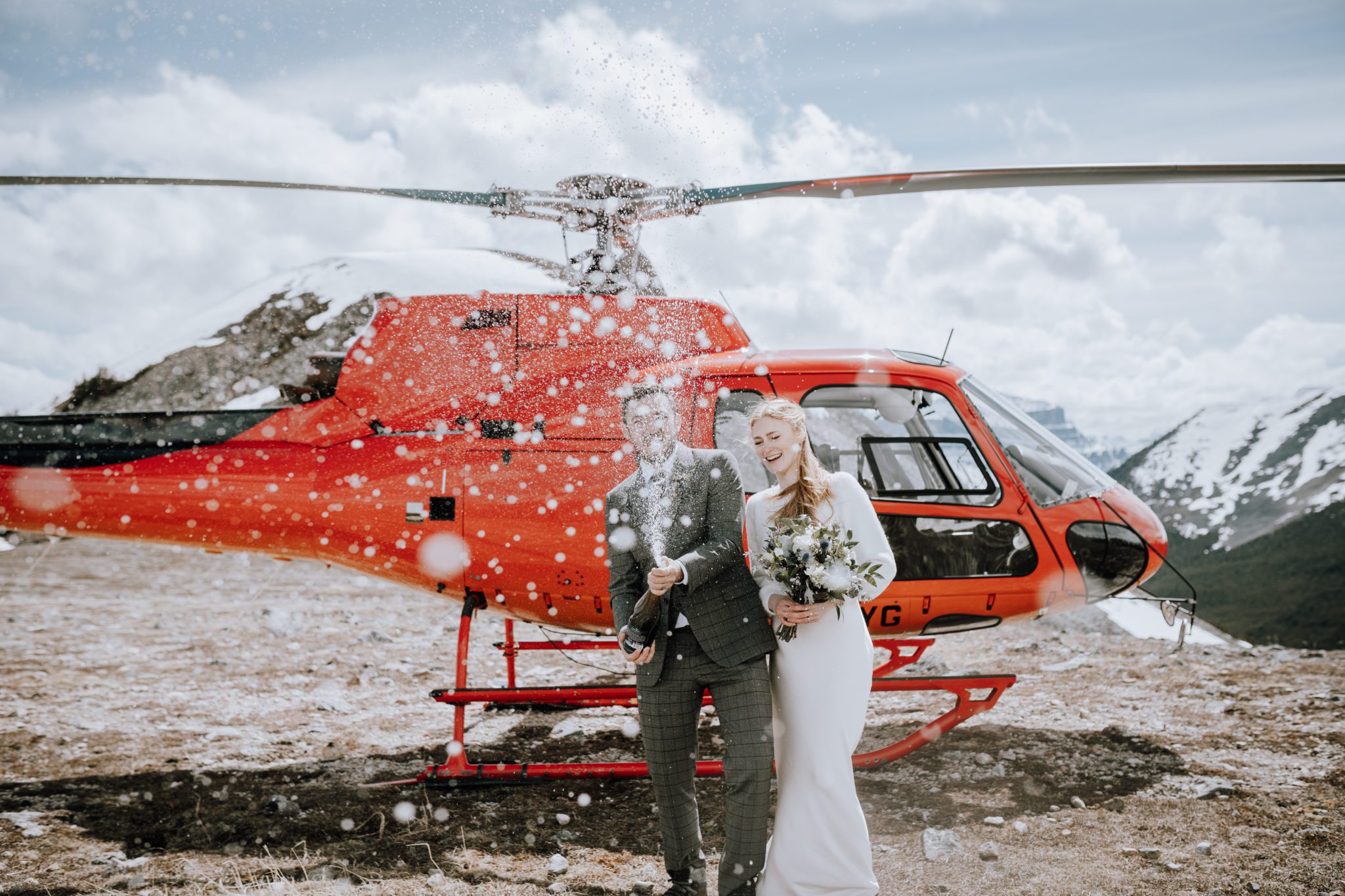 Champagne toast and helicopter tour for this adventure elopement