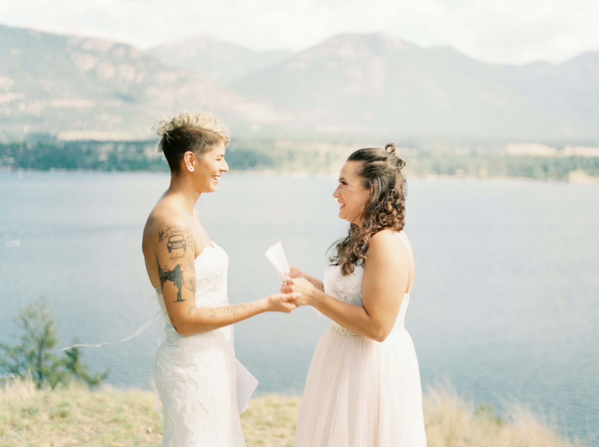 Brides share their vows with each other beside at an Invermere wedding ceremony