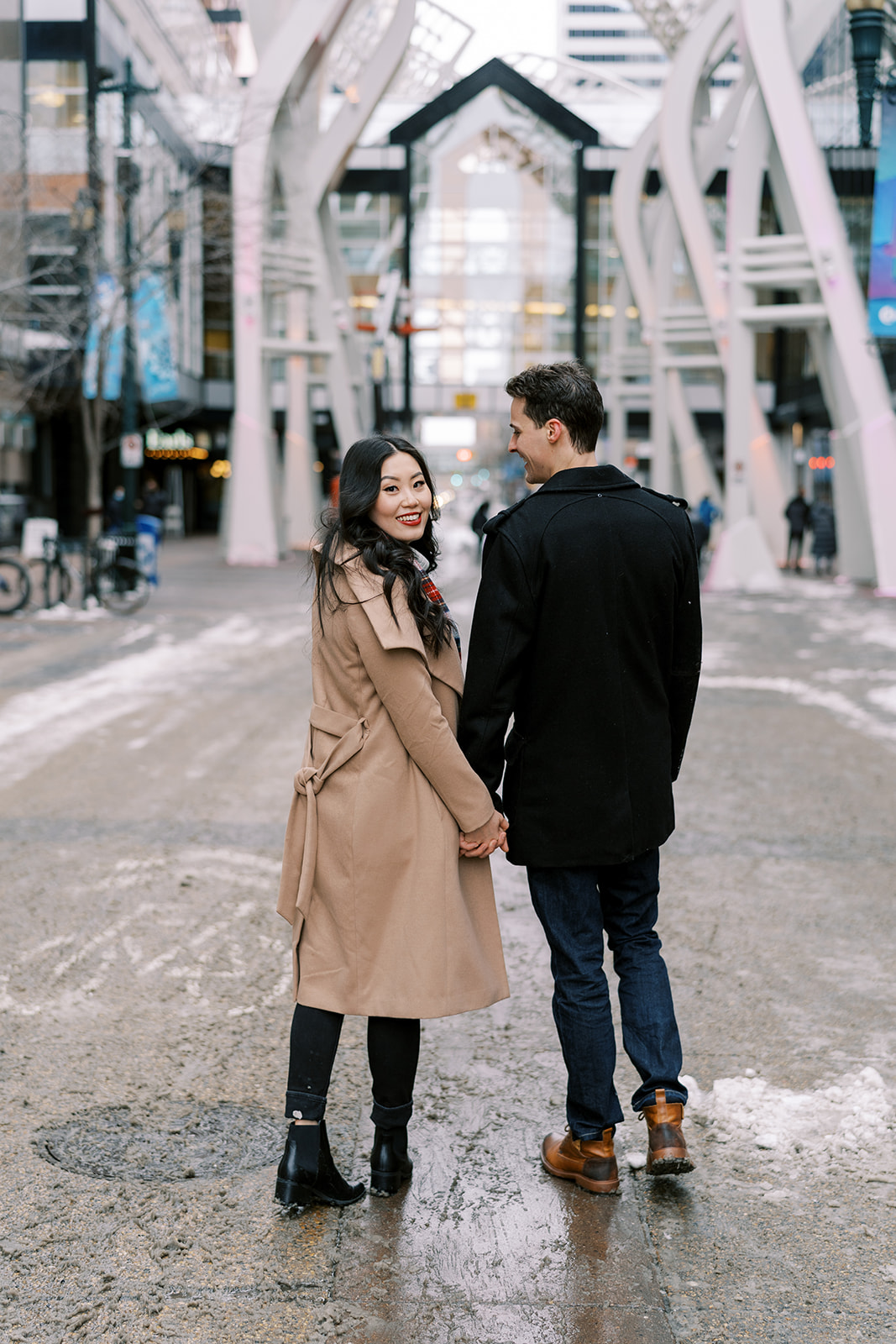 Downtown YYC engagement session with cute outfit ideas and industrial buildings