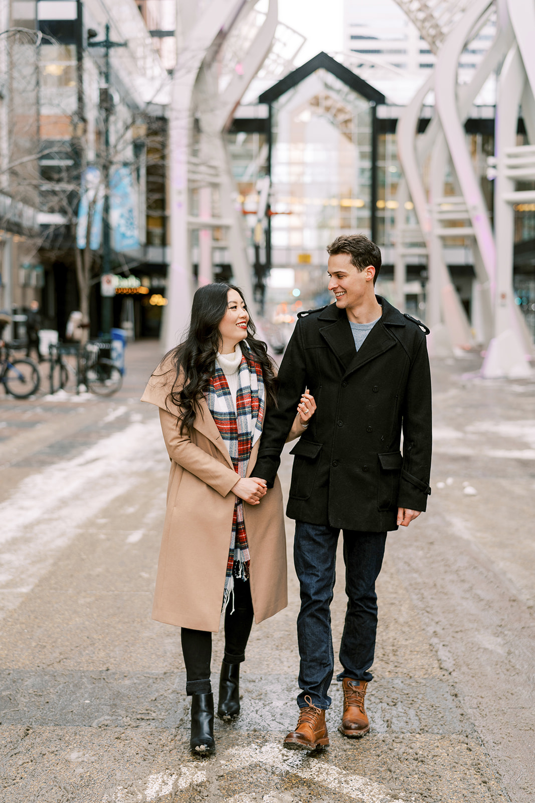 Winter Engagement Session Outfit Inspiration in this Cute Couples Engagement Session in Downtown Calgary