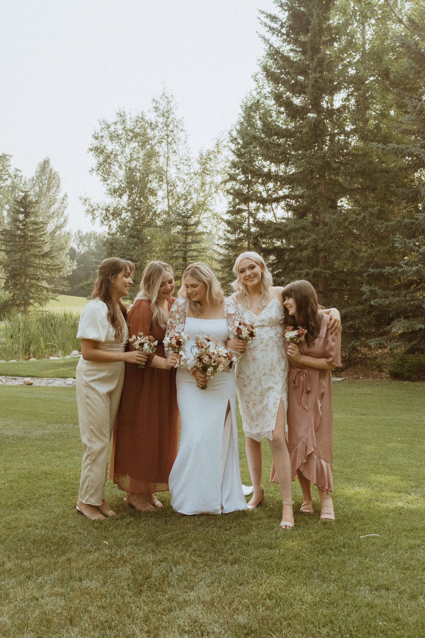 Bridal party for cottage core wedding, outdoor summer bridal attire, mismatched bridesmaids dresses