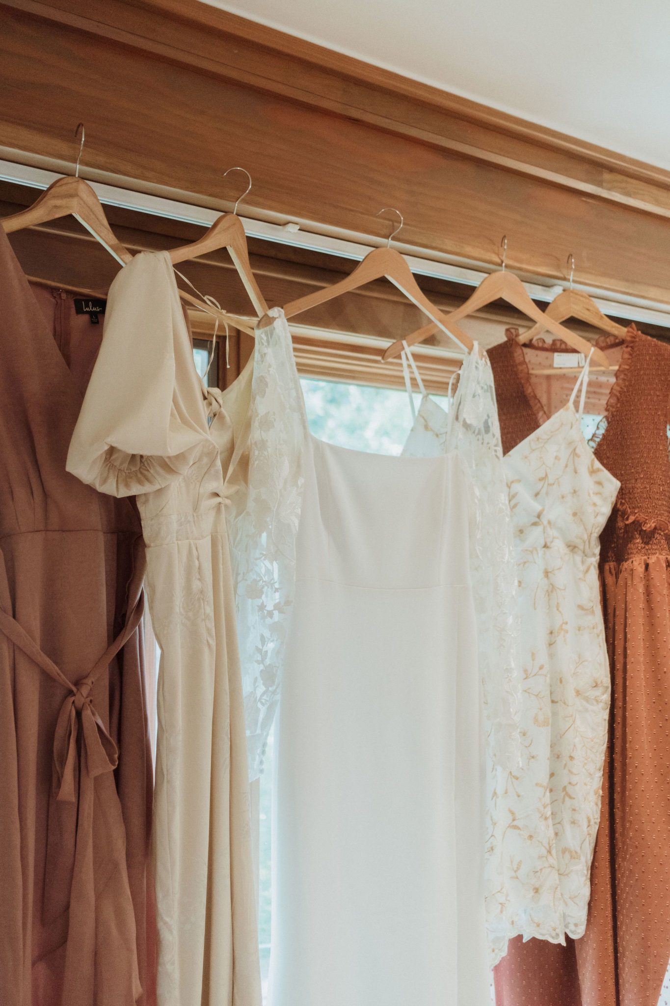 Getting ready for cottage core wedding, bride and bridesmaid's dresses