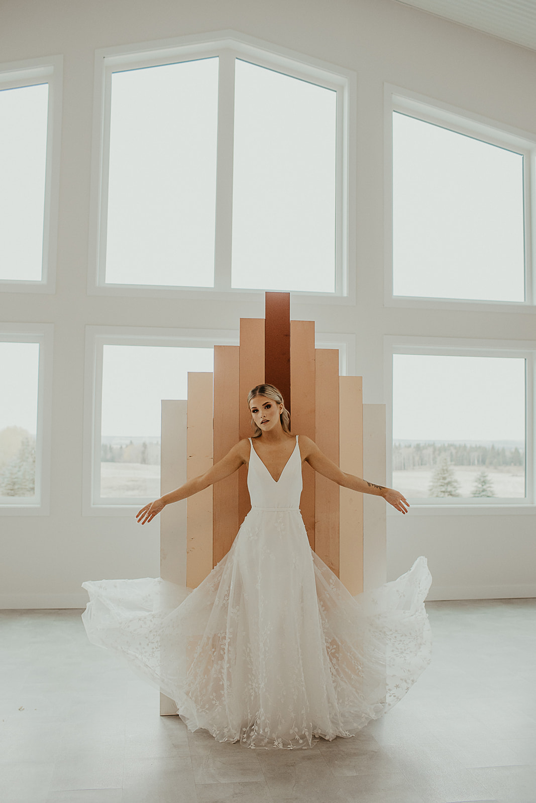 Modern wedding inspiration with unique backdrop, white walls and minimal accents at Tin Roof Event Centre