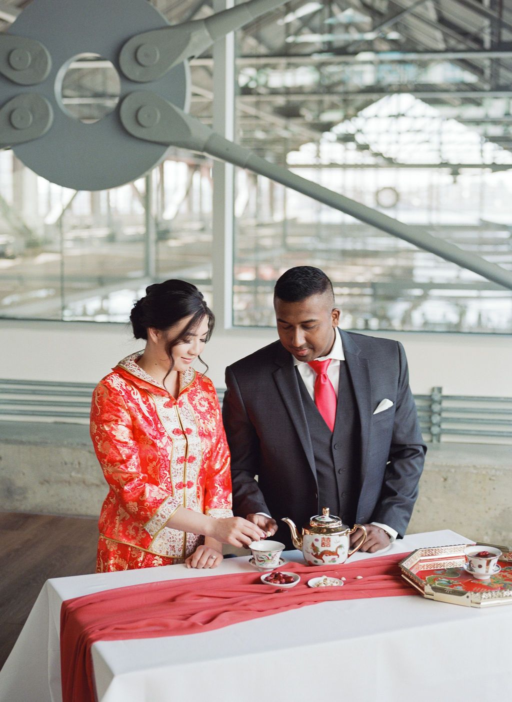 Multicultural wedding inspiration in Vancouver, couple shares intimate moment during tea ceremony