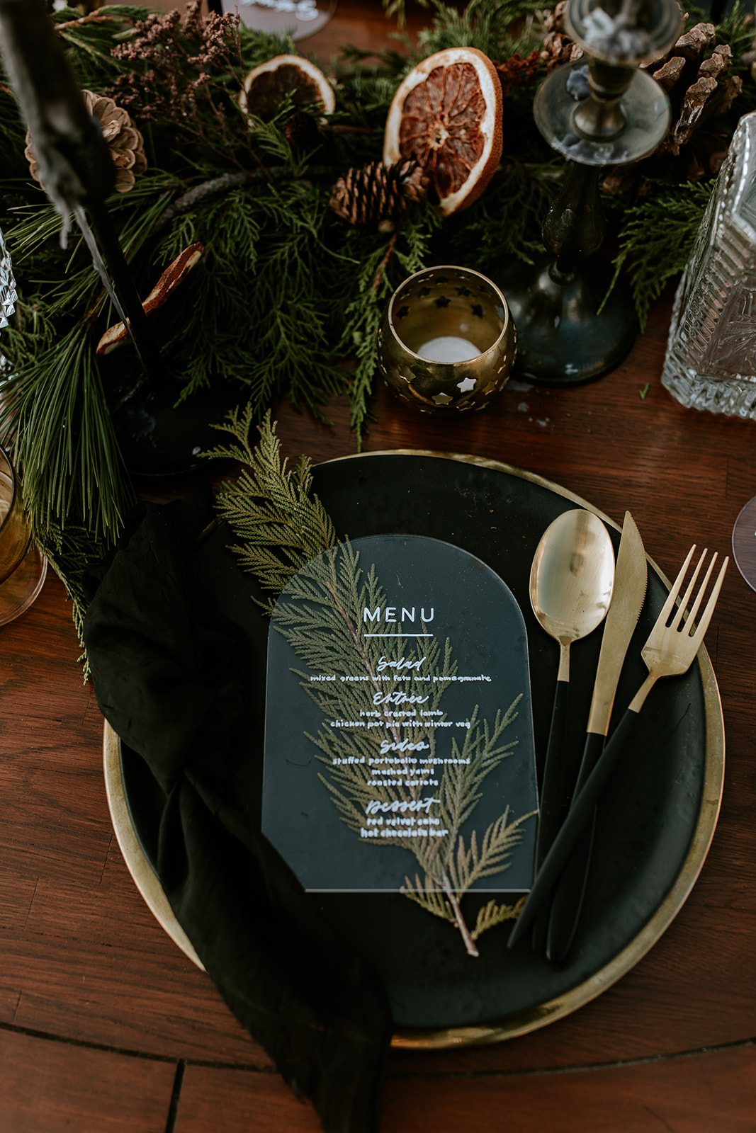 Winter wedding tablescape inspiration, clear acrylic arch menu, black and gold accents