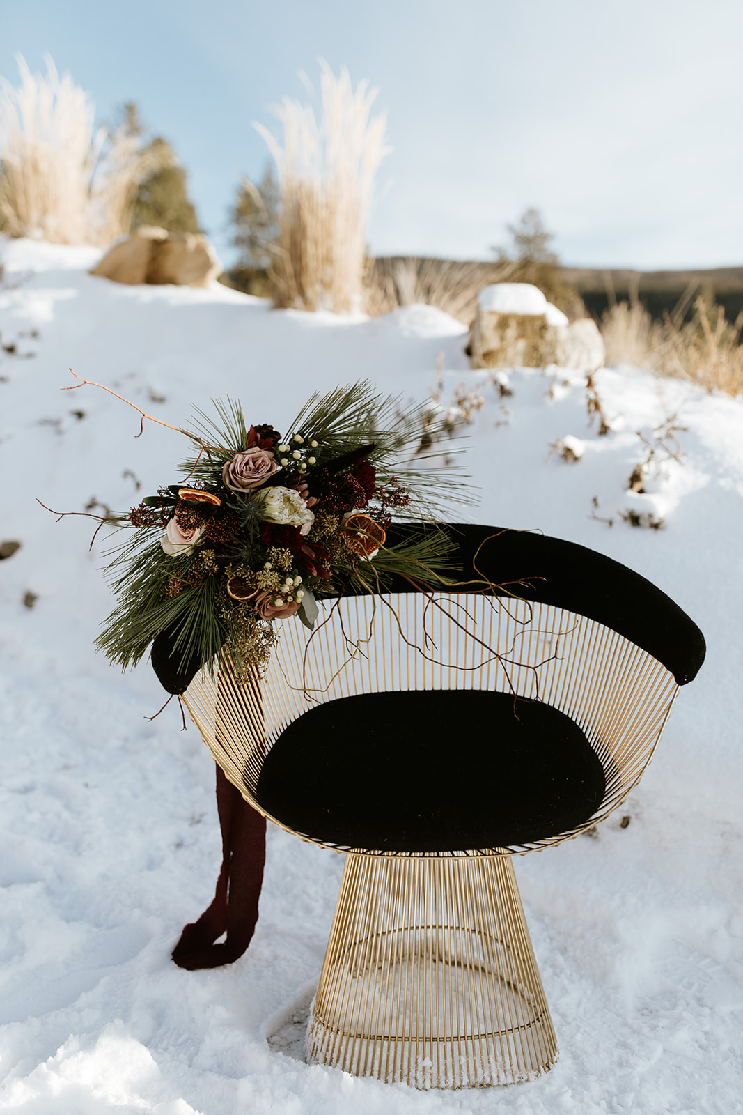 Vintage meets modern winter elopement inspiration shoot in BC, evergreen bridal bouquet inspo