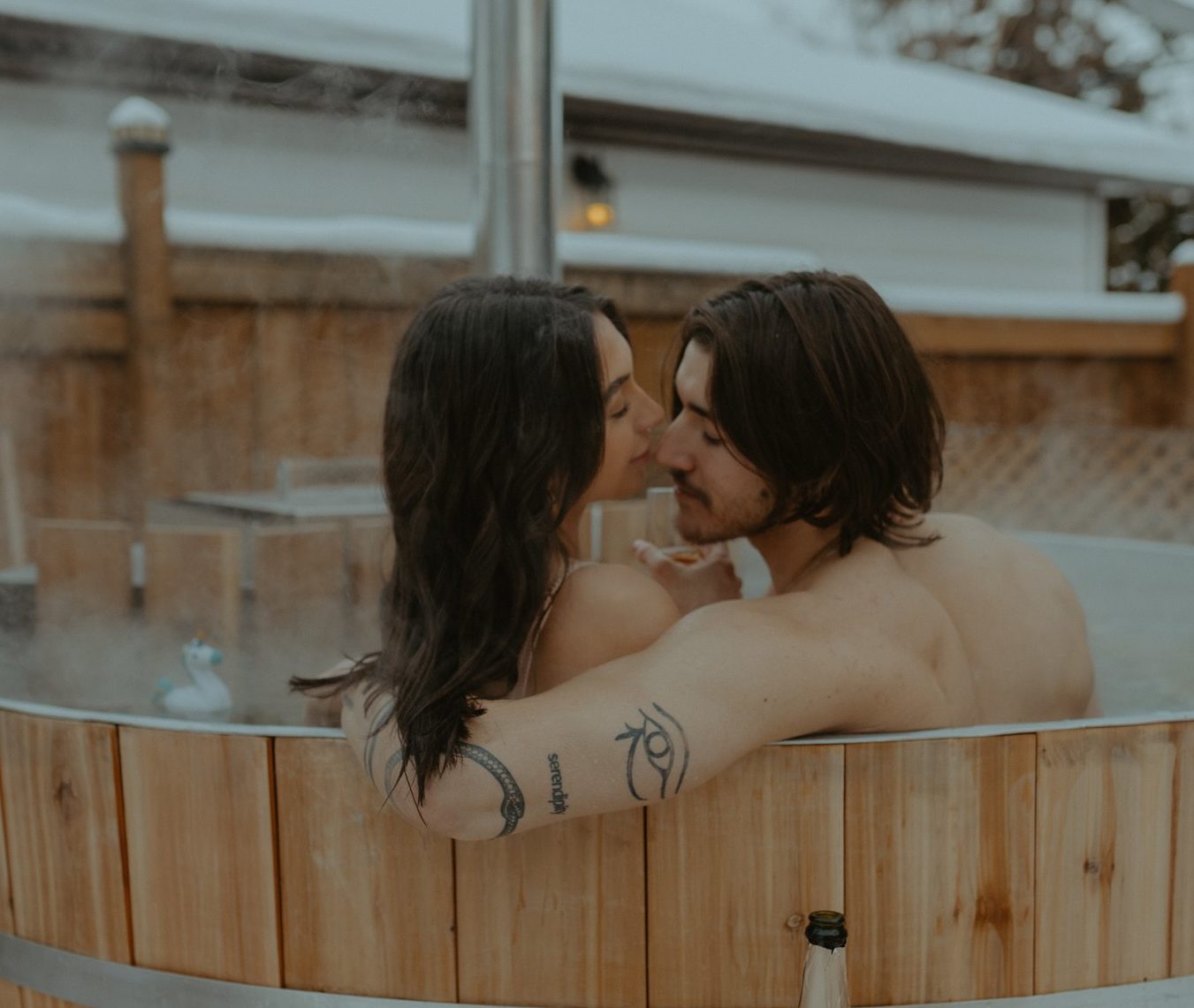 Steamy engagement session inspiration with hot tub, unique engagement session ideas in Edmonton winter