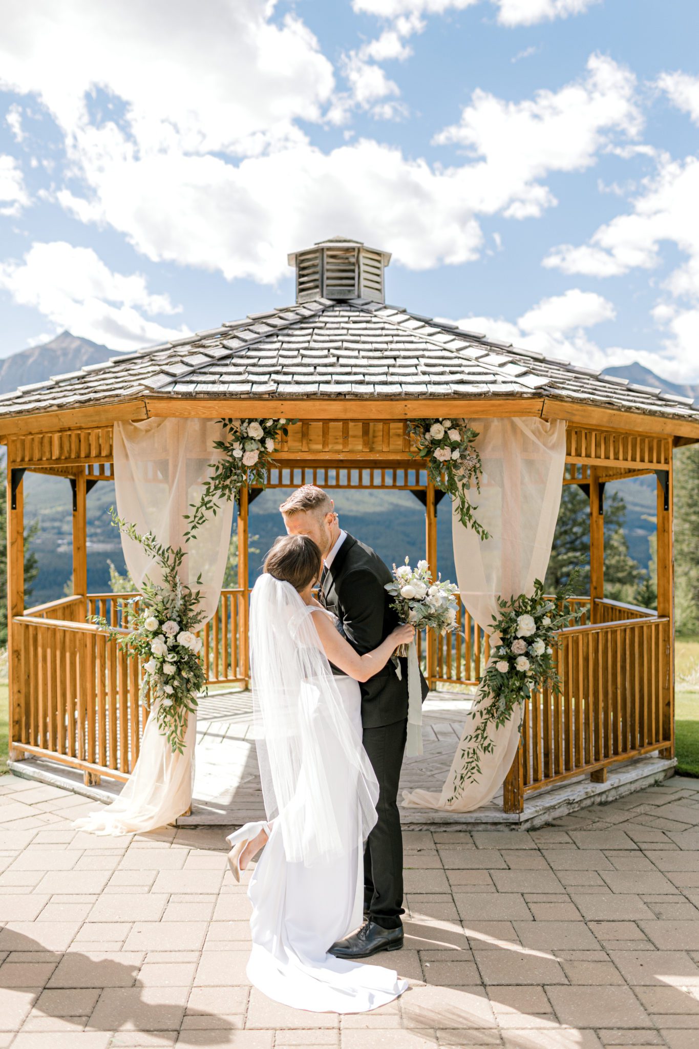Intimate summer wedding at Silvertip Resort in Canmore, gazebo wedding ceremony inspiration.