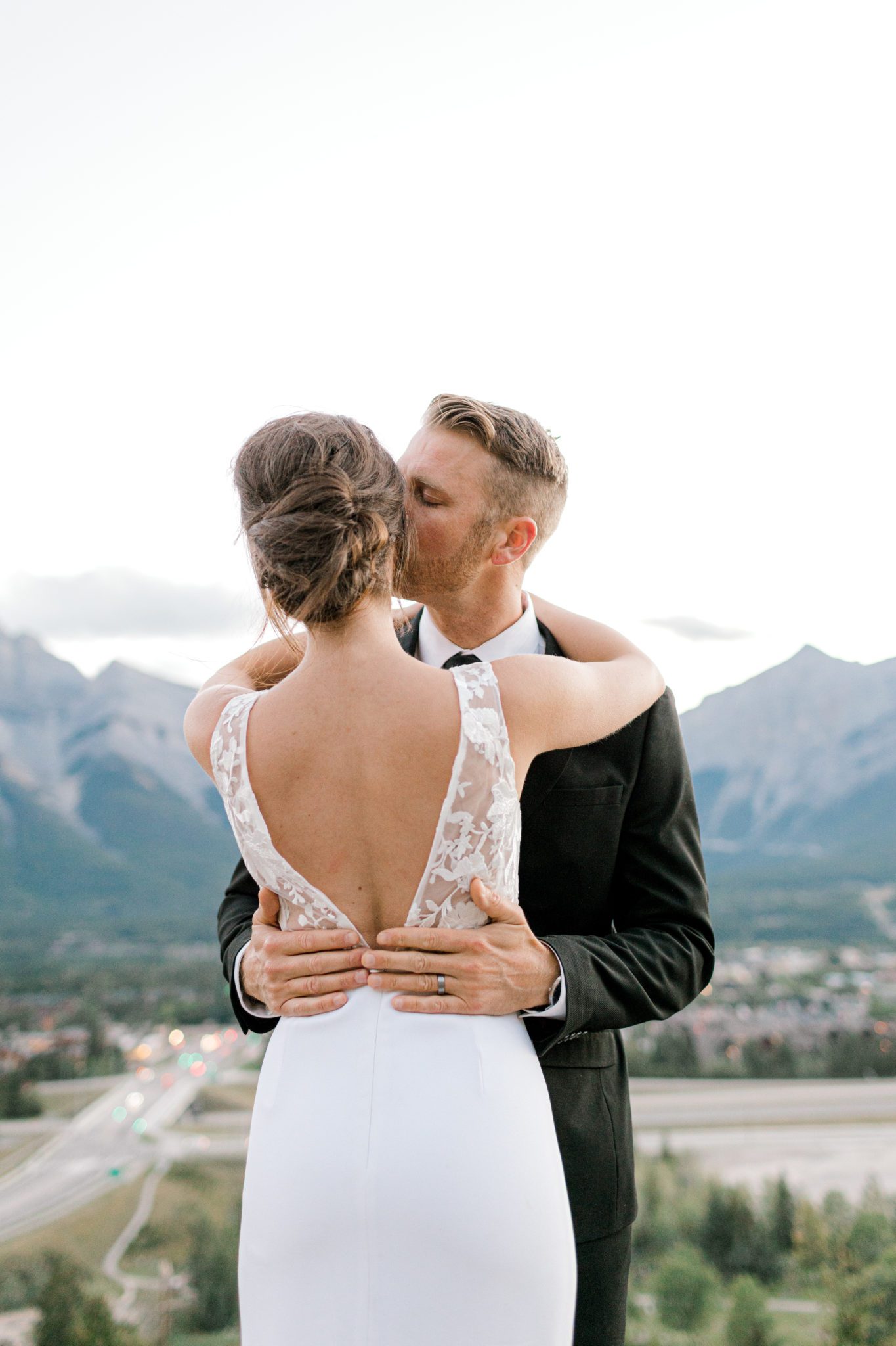 Chic crepe wedding dress from park and fifth at outdoor Canmore wedding.