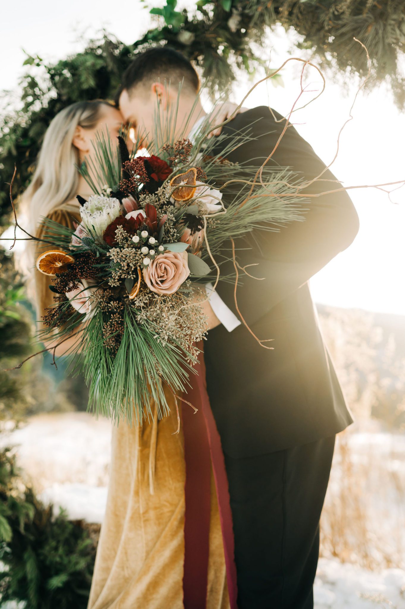 Winter wedding bouquet inspiration with roses and candied oranges, unique bouquet inspiration