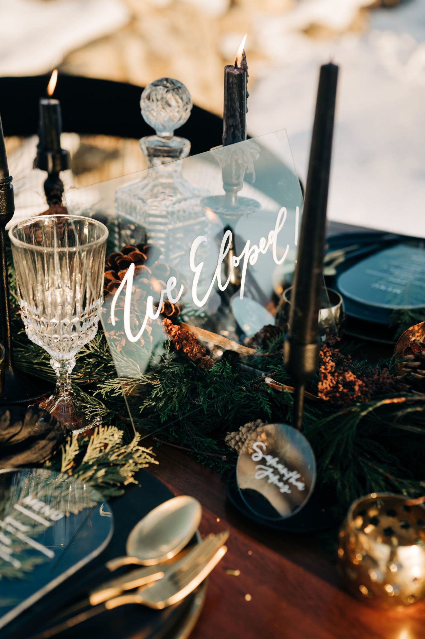 Outdoor table scape with acrylic signage, candle lit elopement at golden hour