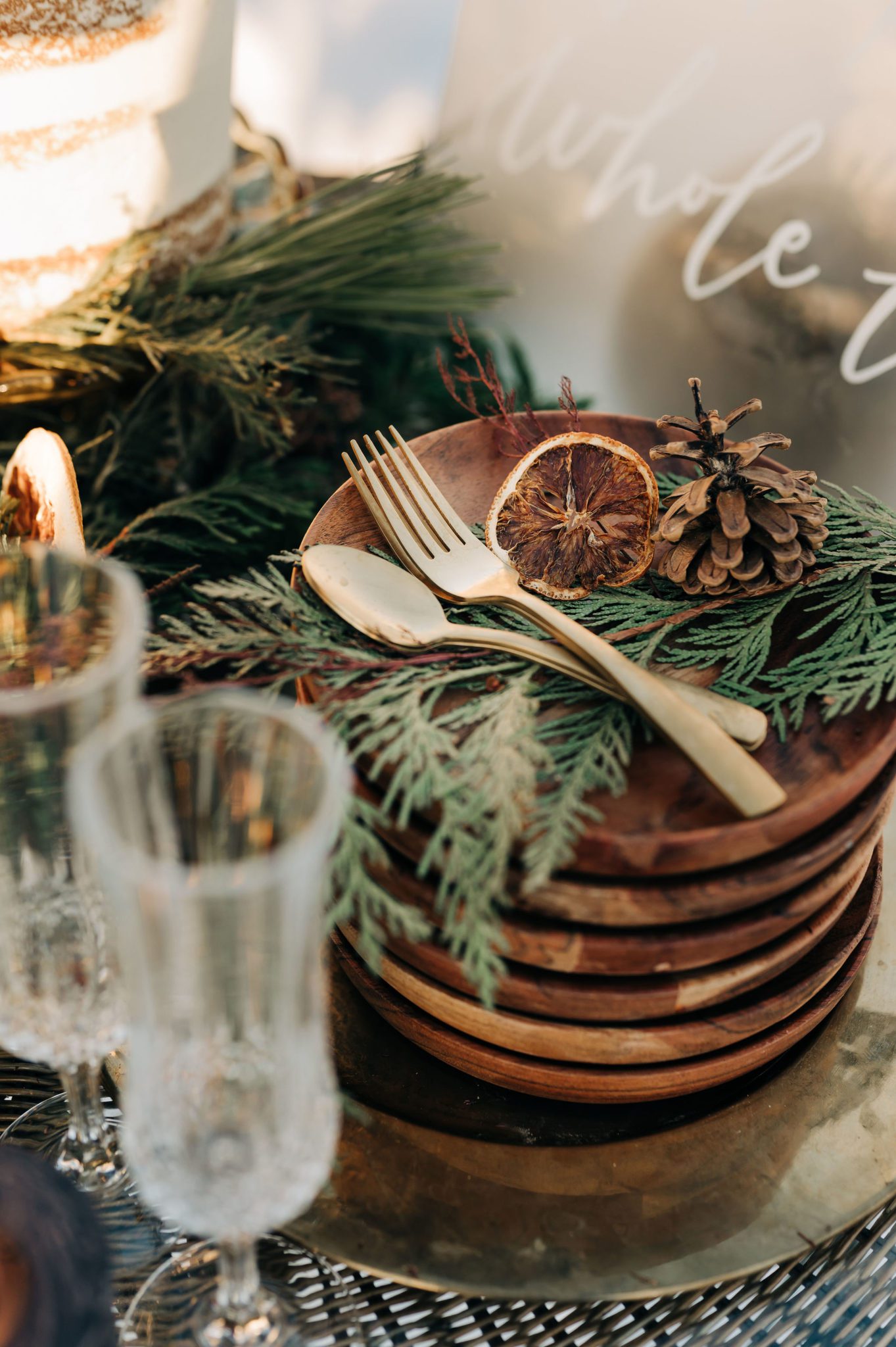 Rustic winter table scape with candied orange and pine, champagne elopement