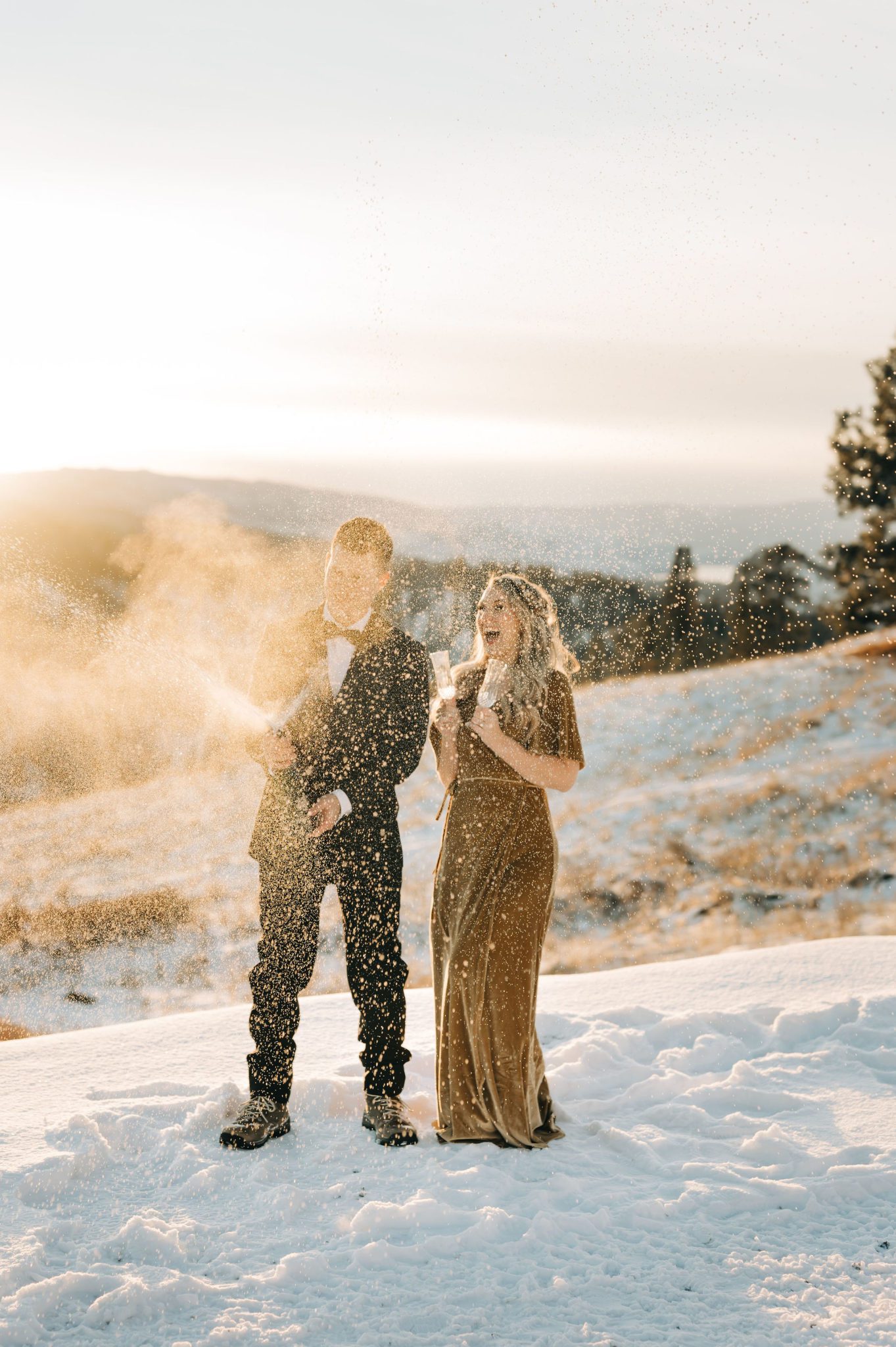 Popping the champagne at this intimate winter BC elopement, winter wedding inspiration