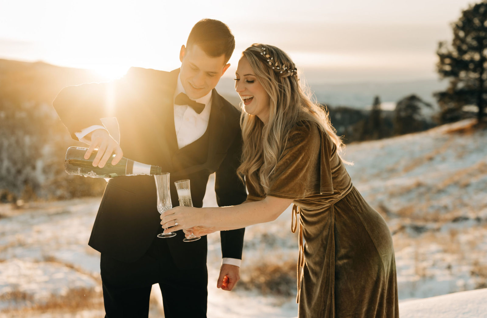 Couple pours champagne for their golden hour winter elopement in the Okanagan, bridal headpiece inspiration