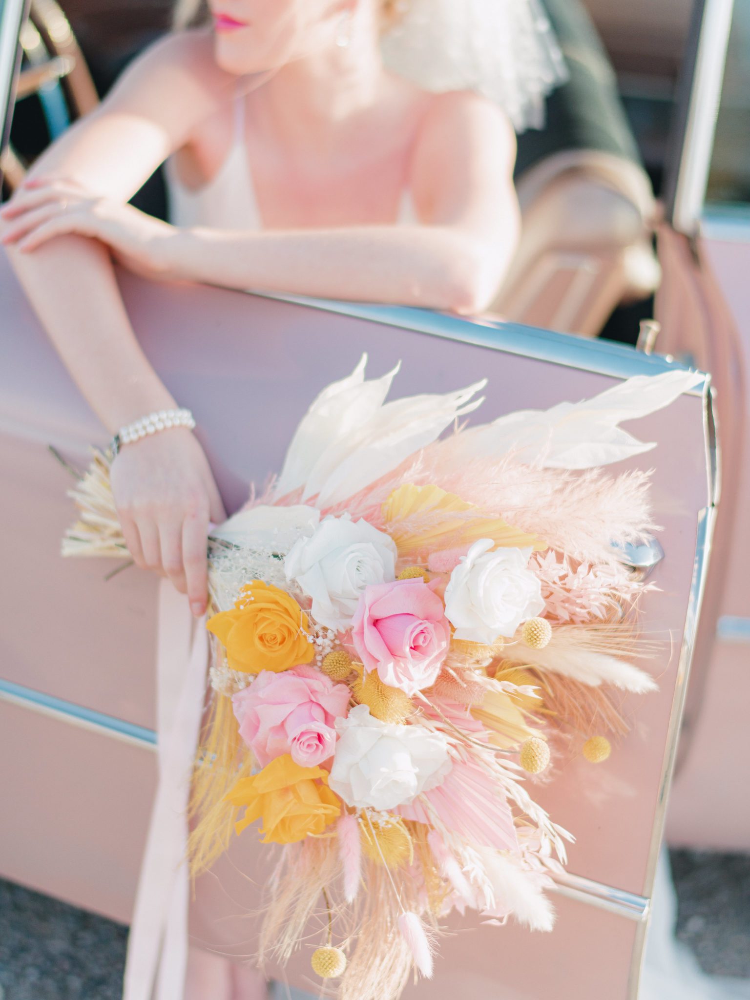 Electric bridal bouquet featuring bright pink and yellow, modern bouquet inspiration
