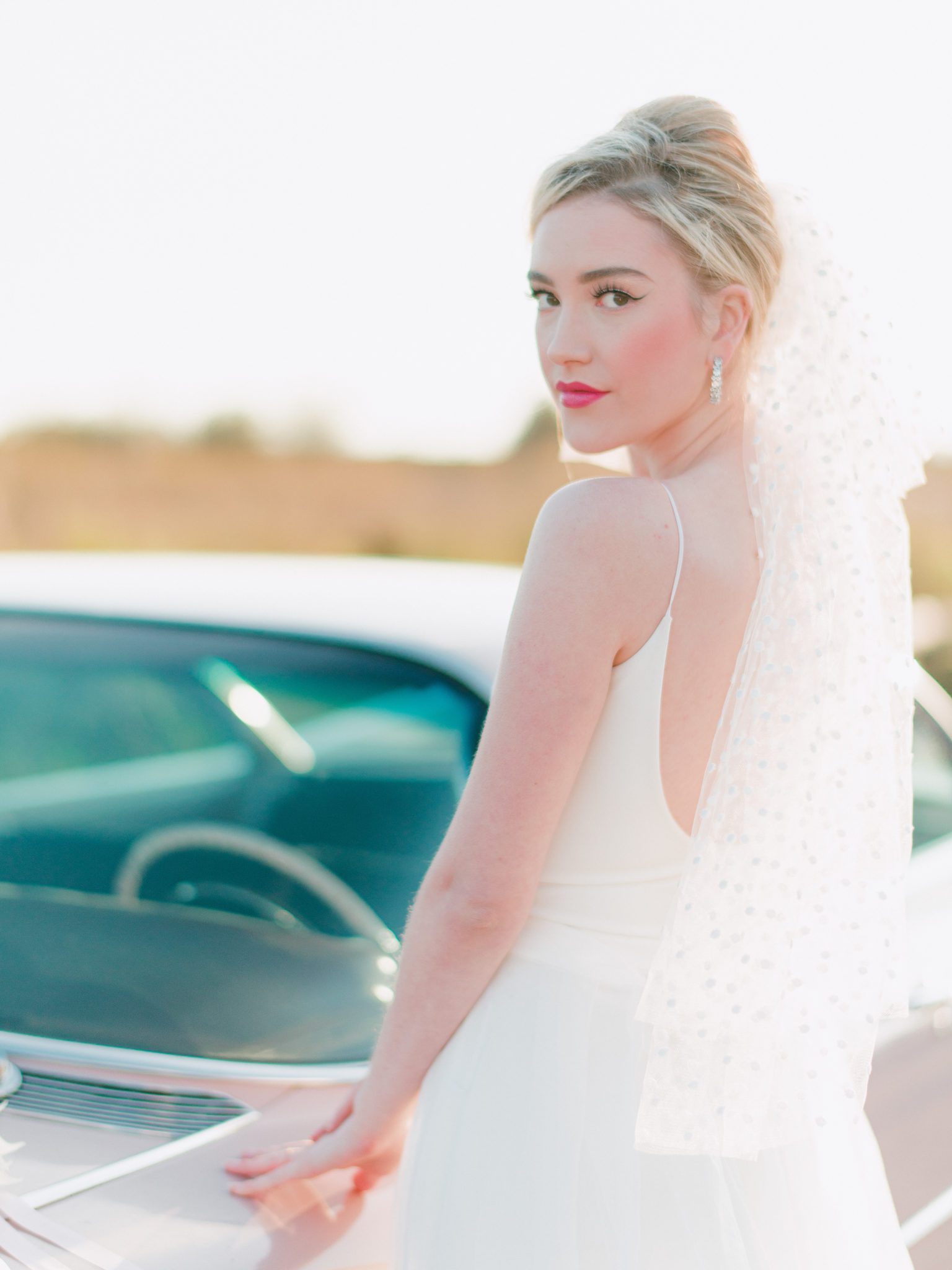 Coolest bridal vibes featuring pink Cadillac and retro style, 2022 bridal trends