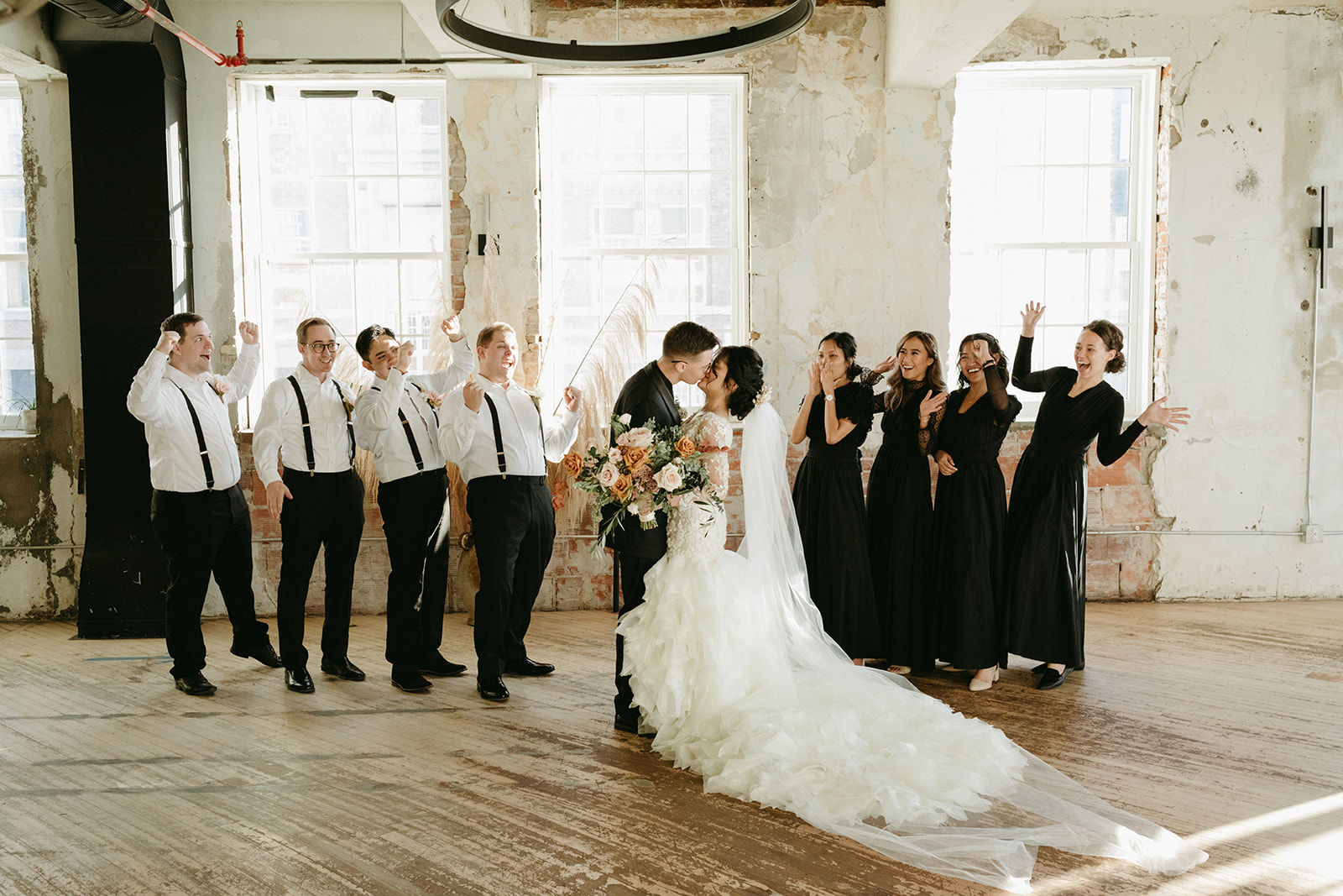 Bride and groom with bridal party at black and white vintage wedding