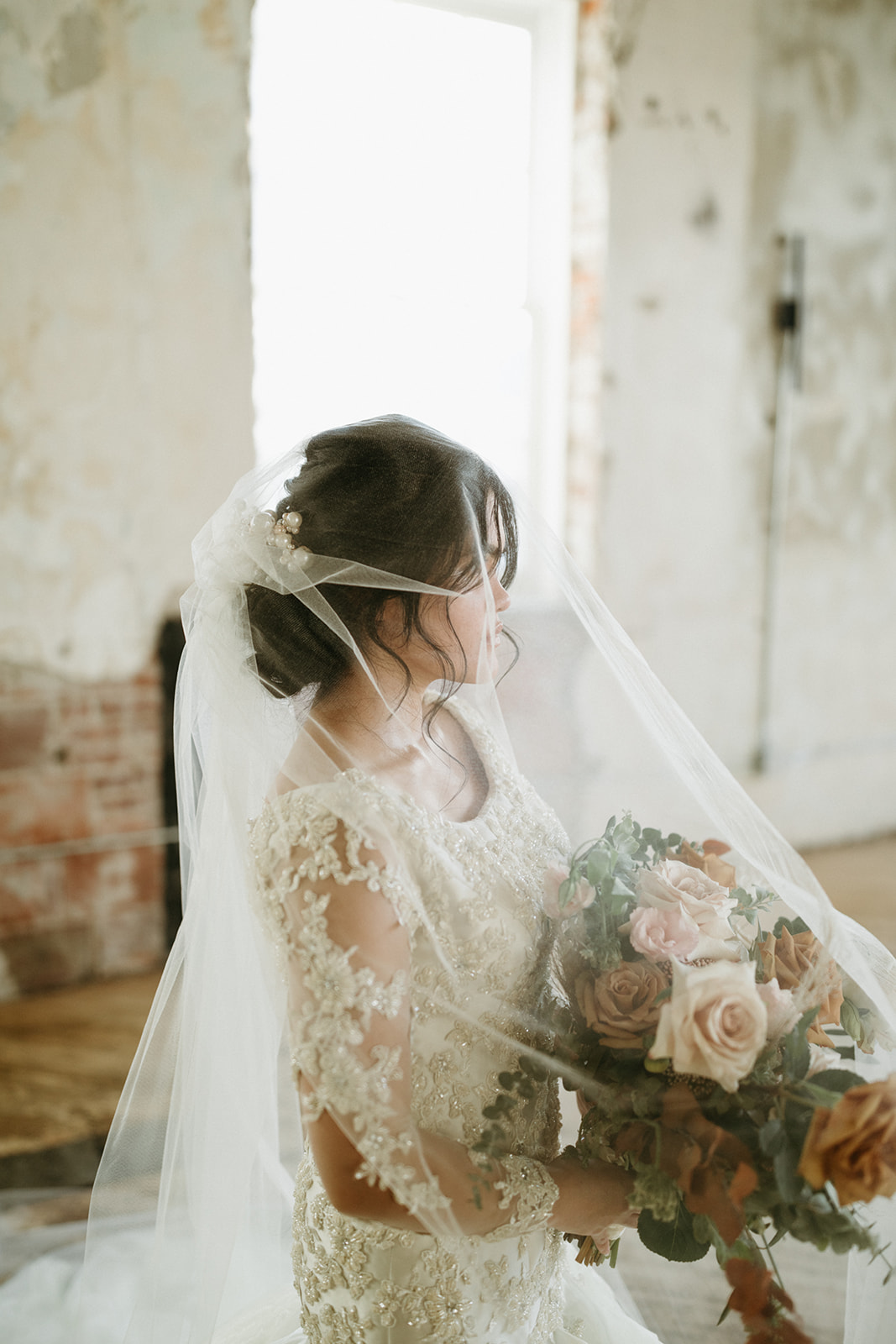 Bridal portraits with viel and lace gown
