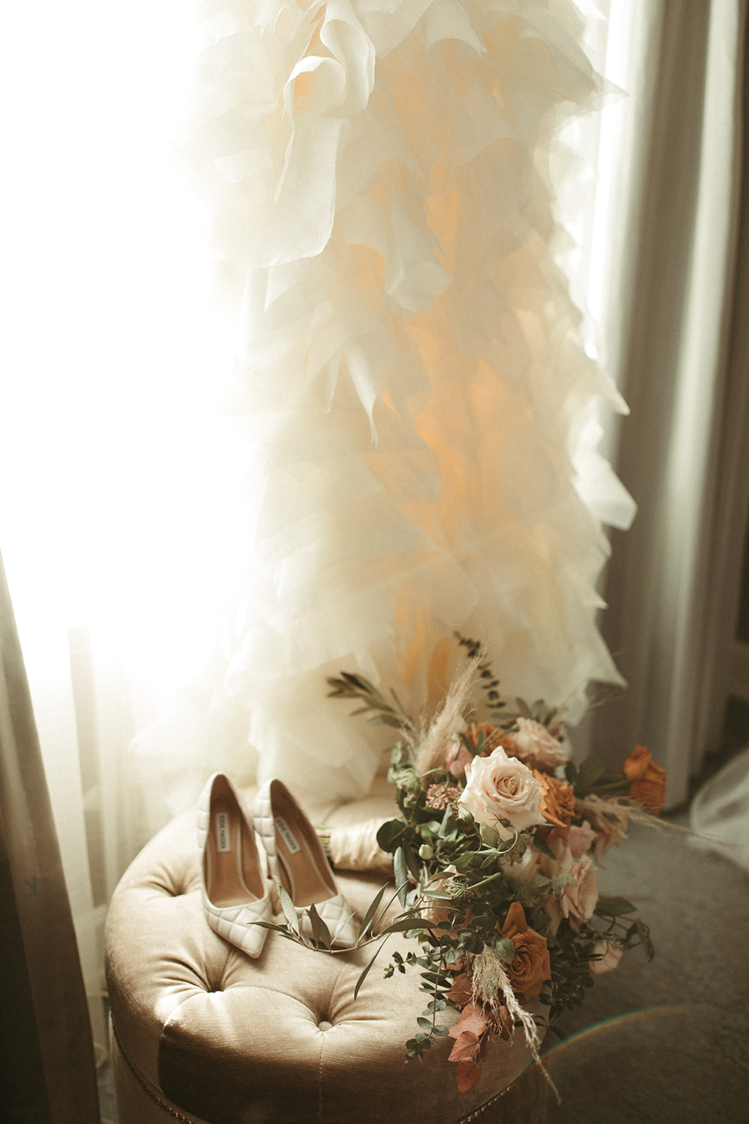 Wedding detials with gown, shoes, and bouquet