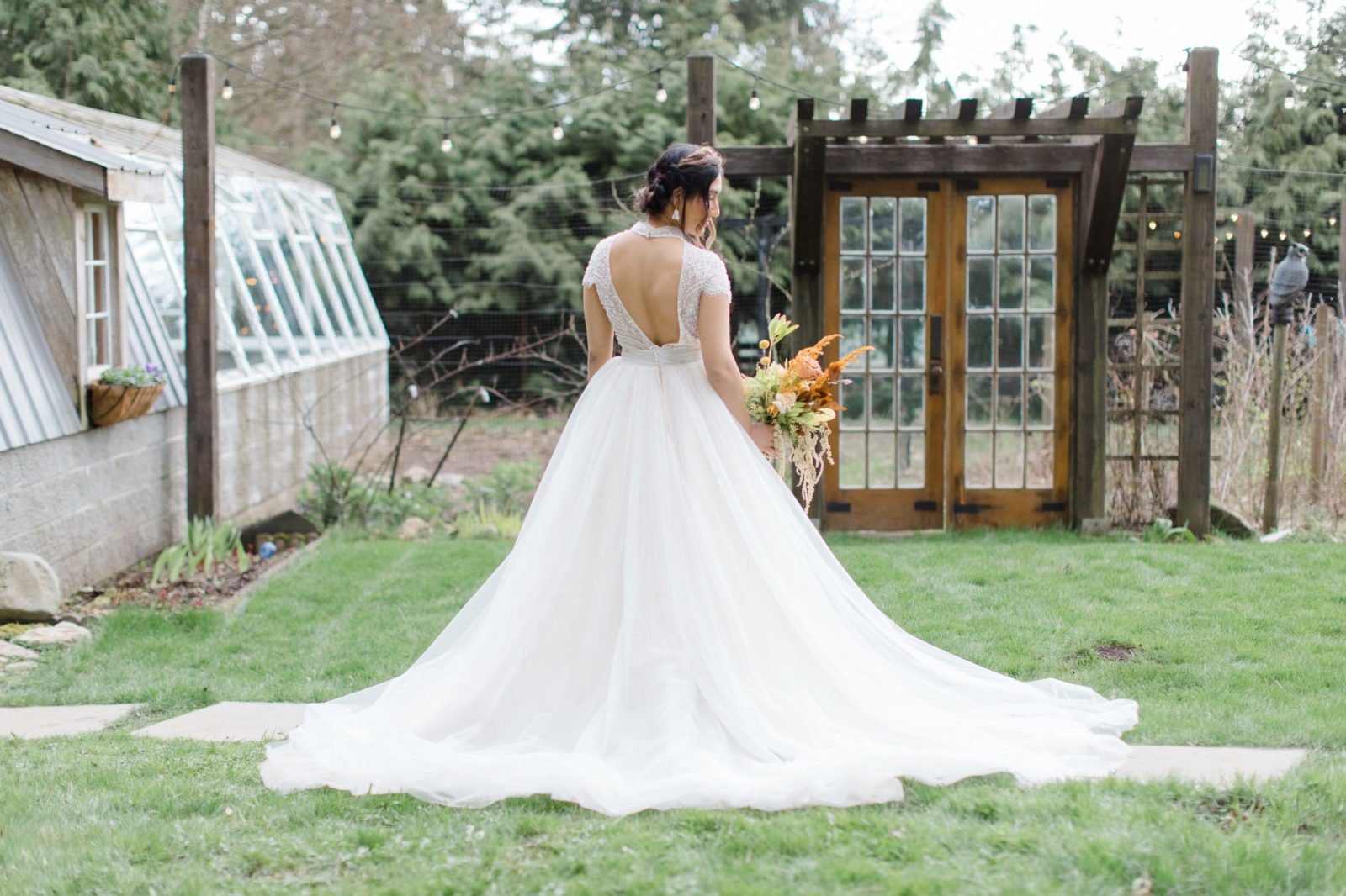 bridal portraits at this outdoor greenhouse wedding, fall wedding inspiration, bright floral bouquet