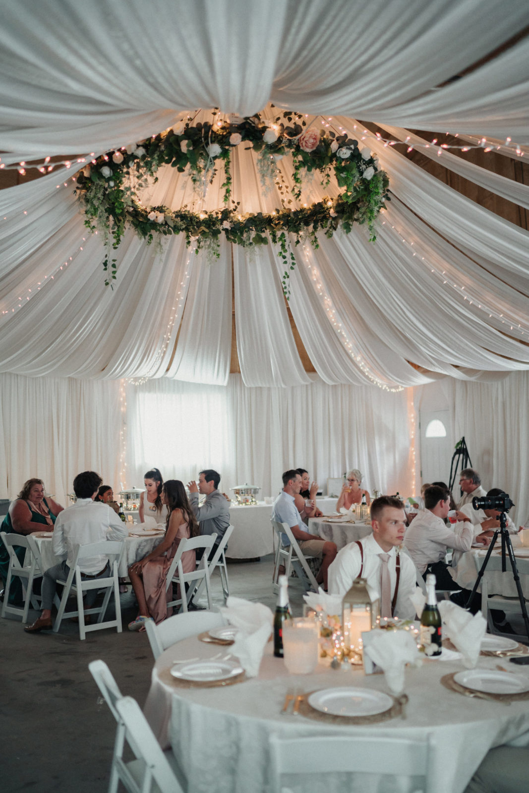 Wedding reception with greenery and white