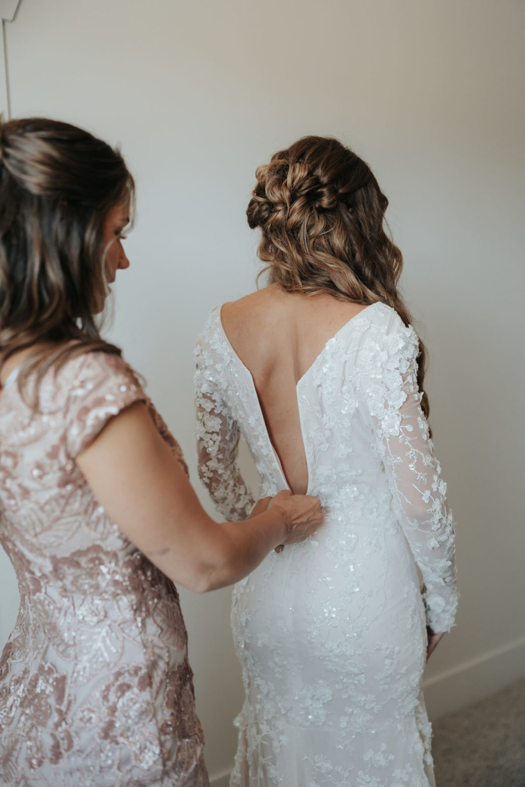 bride getting ready for wedding, floral lace gown