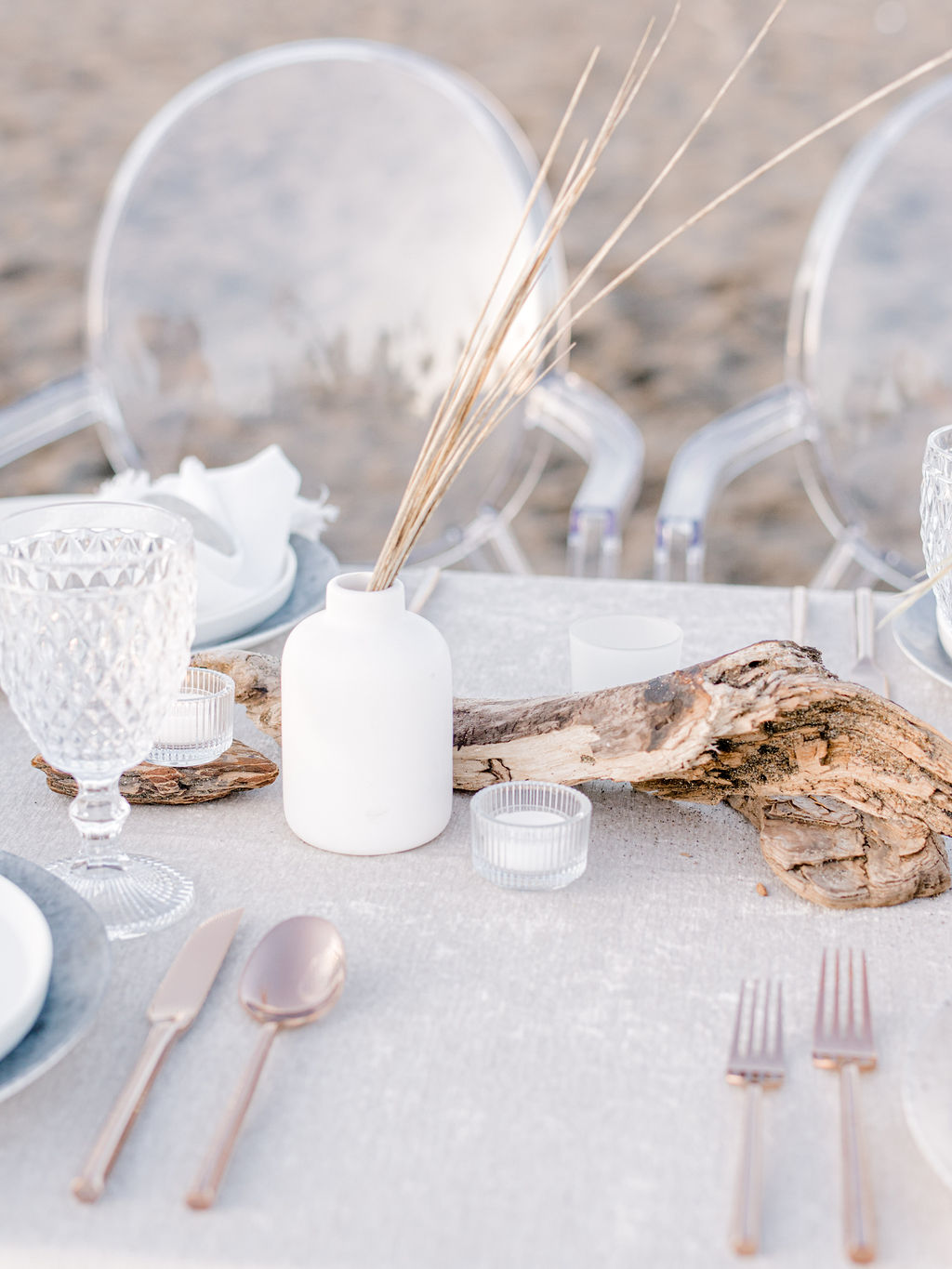 Romantic alfresco dinner along the beach for an intimate Vancouver wedding, spring and summer wedding inspiration in Canada, modern wedding tablescape design with velvet linens and ghost chair seating, 