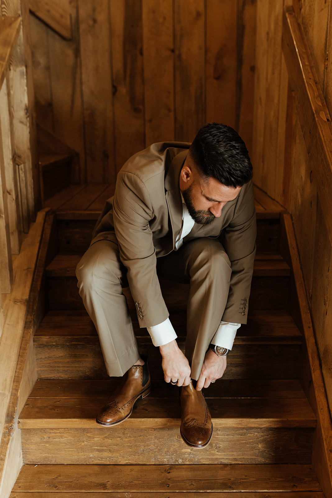rustic chic barn wedding with warm wood tones, groom attire inspiration, brown suit