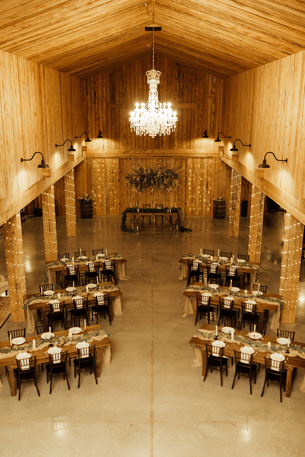 rustic indoor barn venue in Alberta, warm and wood toned wedding inspiration