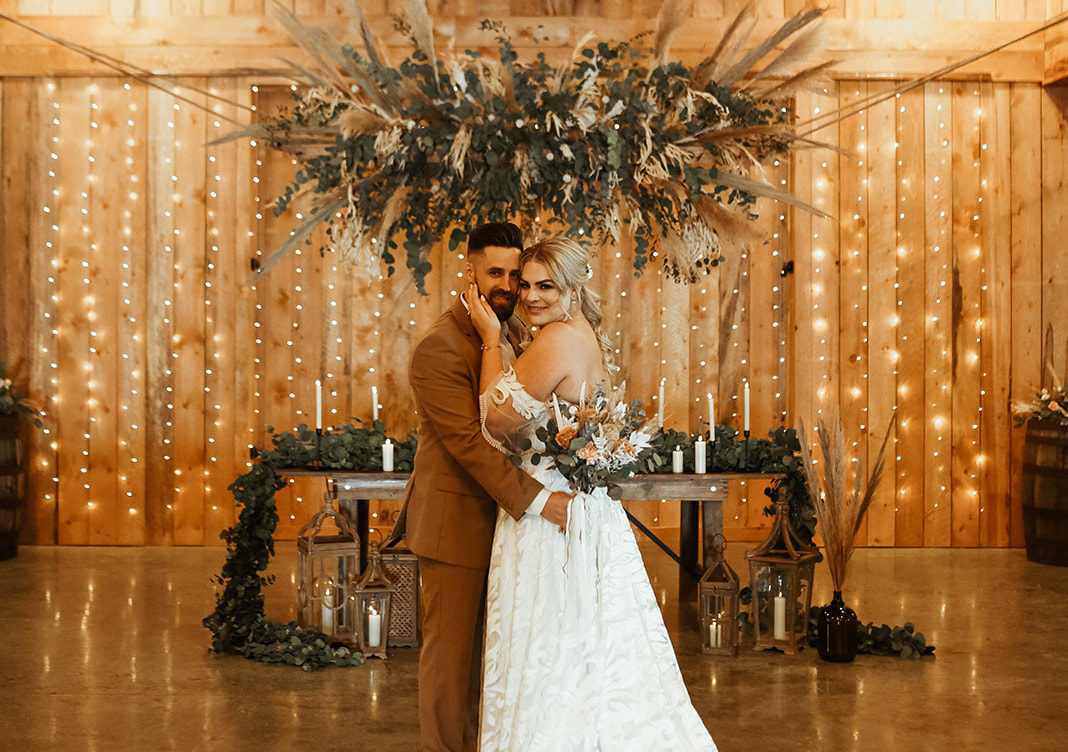 Wedding inspiration at Sweet Haven Barn with rustic chic aesthetic, dried floral and foliage arch