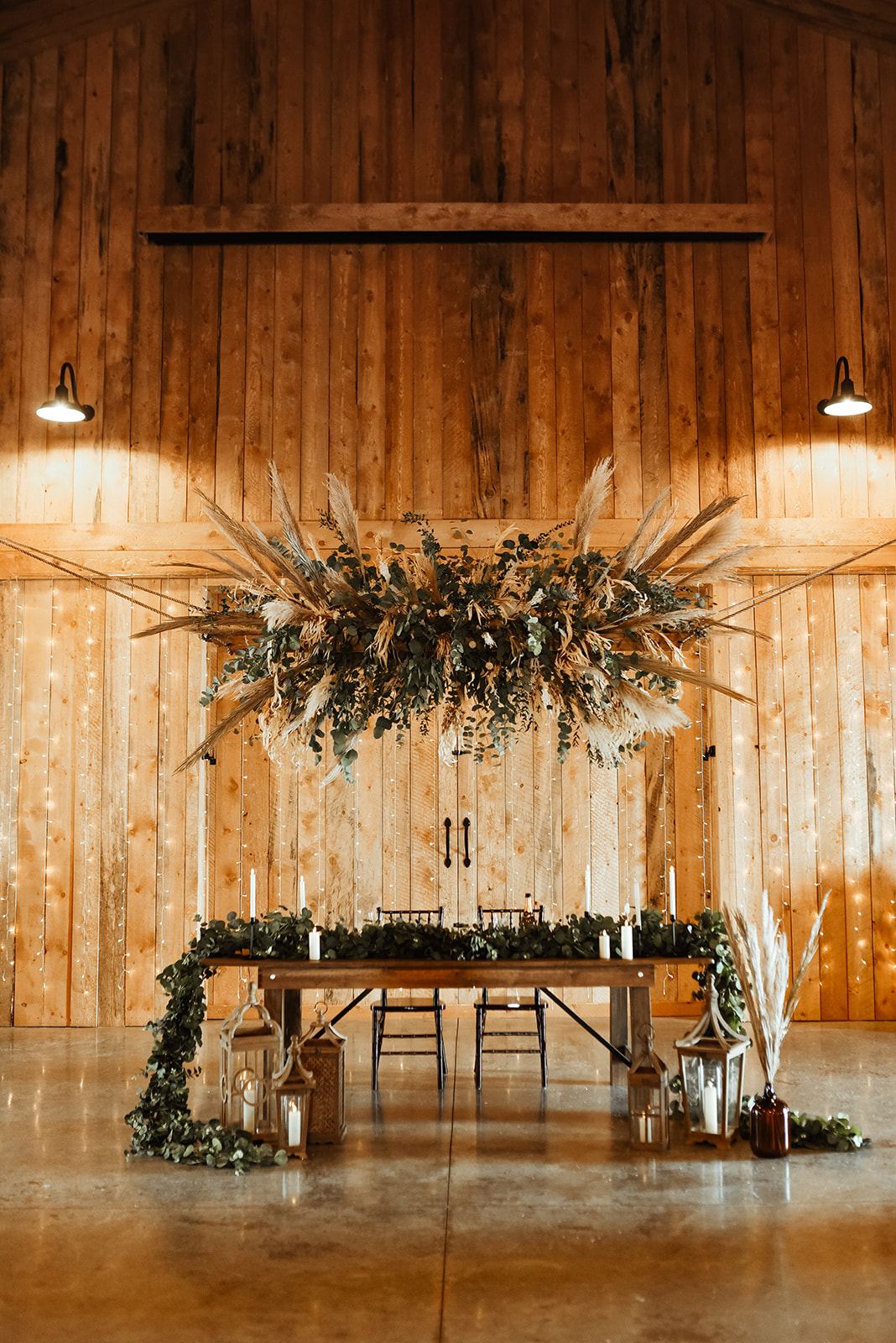 sweetheart table for rustic barn wedding, dried floral and foliage