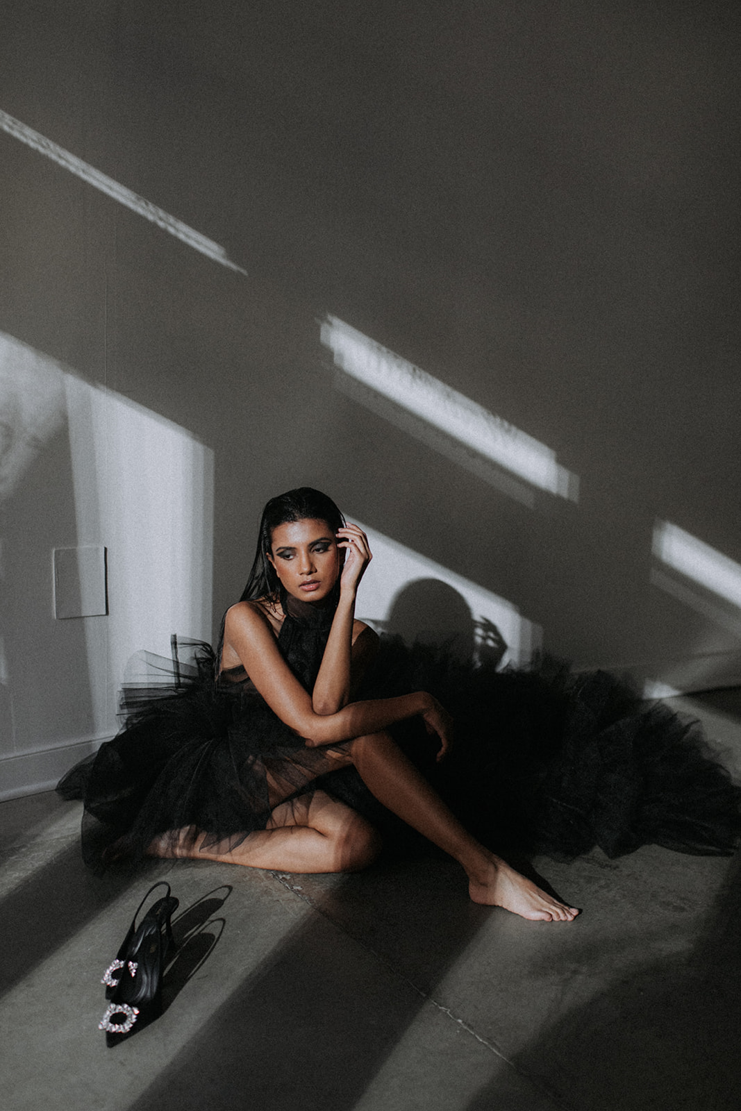 Modern & Moody All-Black Editorial at The Pioneer || featured on the Brontë Bride Blog || modern black editorial in downtown Calgary - edgy alternative wedding inspiration, black wedding gown, black ruffled gown