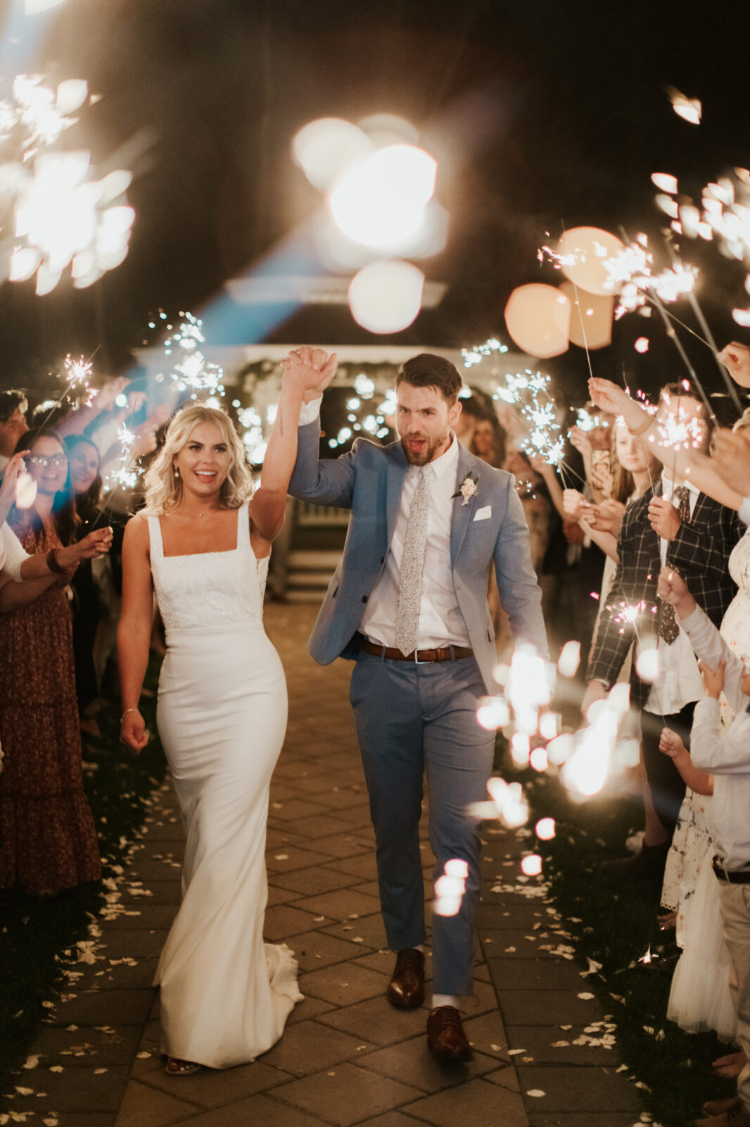 This Lethbridge wedding at Norland Historic Estate features a sparkler exit, vintage blue suits, and an old-school getaway. vintage getaway car, vintage meets classic wedding inspiration, summer wedding inspiration
