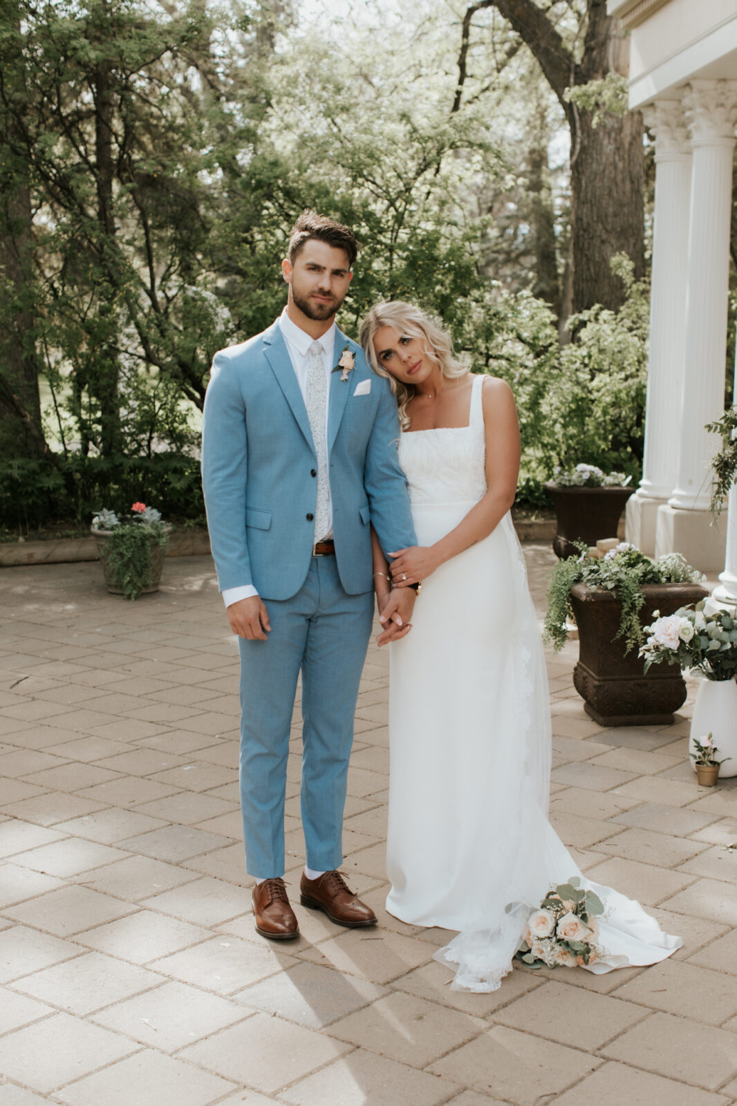 baby blue wedding, vintage meets classic wedding inspiration, summer wedding inspiration. This Lethbridge wedding at Norland Historic Estate features a sparkler exit, vintage blue suits, and an old-school getaway.
